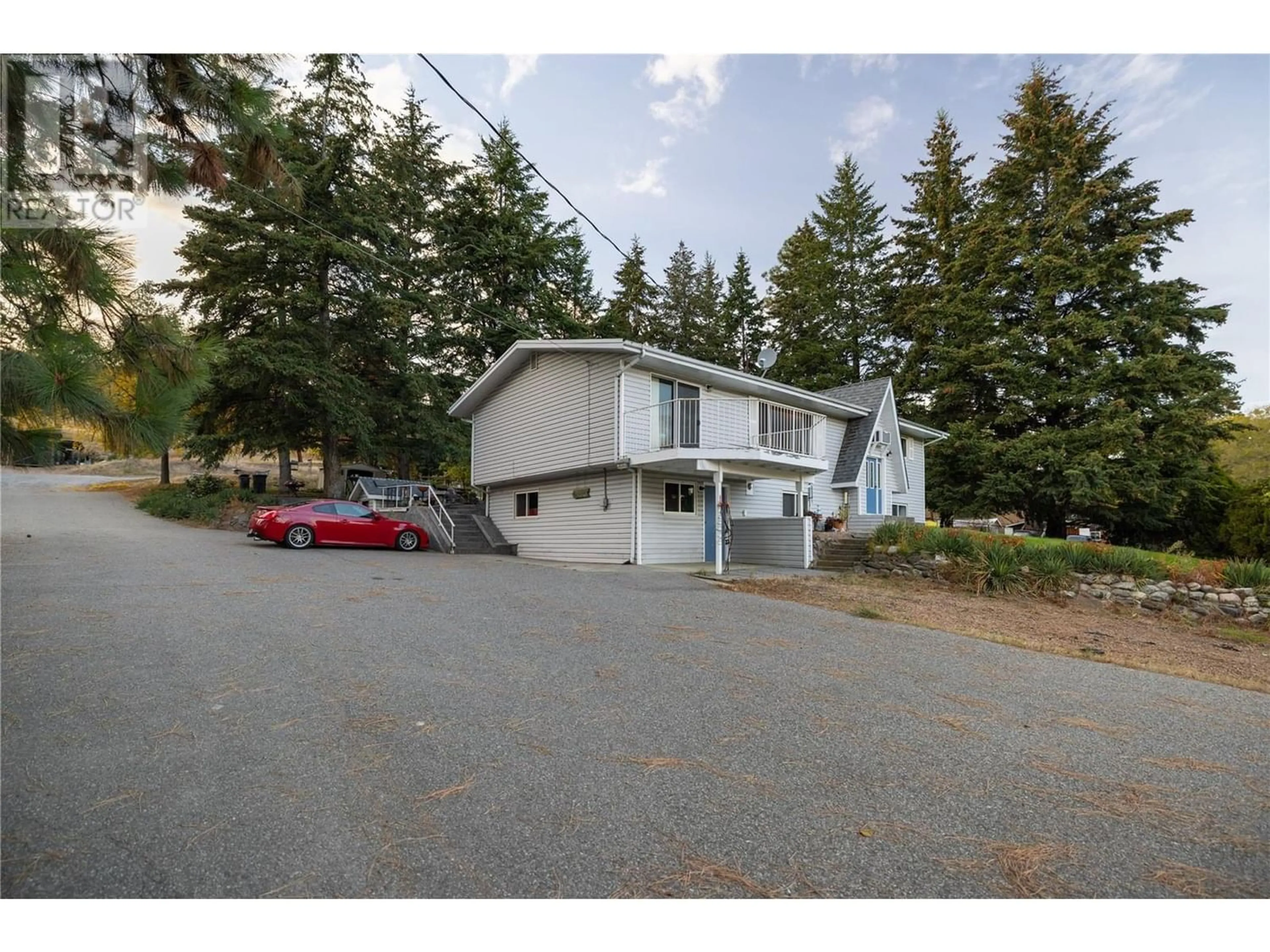 A pic from exterior of the house or condo, the street view for 10750 Highway 97 Highway, Lake Country British Columbia V4V1V3