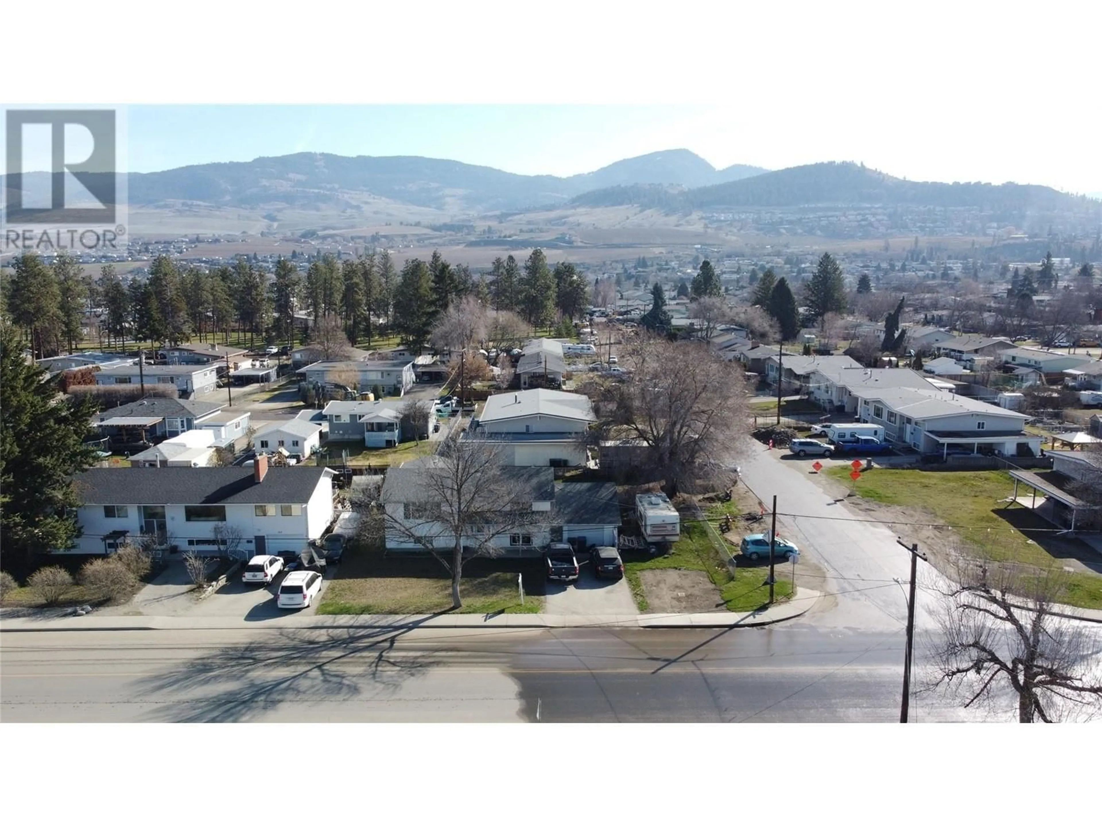 A pic from outside/outdoor area/front of a property/back of a property/a pic from drone, mountain view for 325 DOUGALL ROAD SOUTH, Kelowna British Columbia V1X3J5