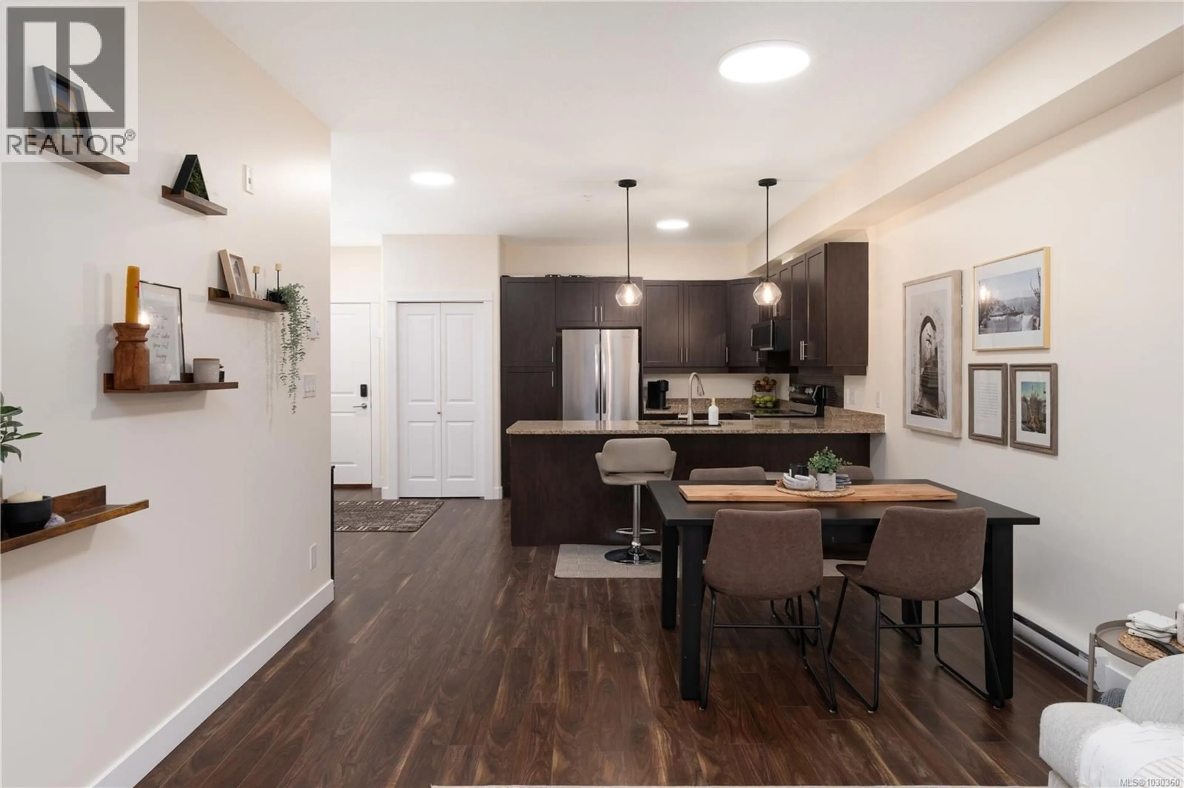 Open concept kitchen, wood/laminate floor for 213 - 938 DUNFORD AVENUE, Langford British Columbia V9B2S3
