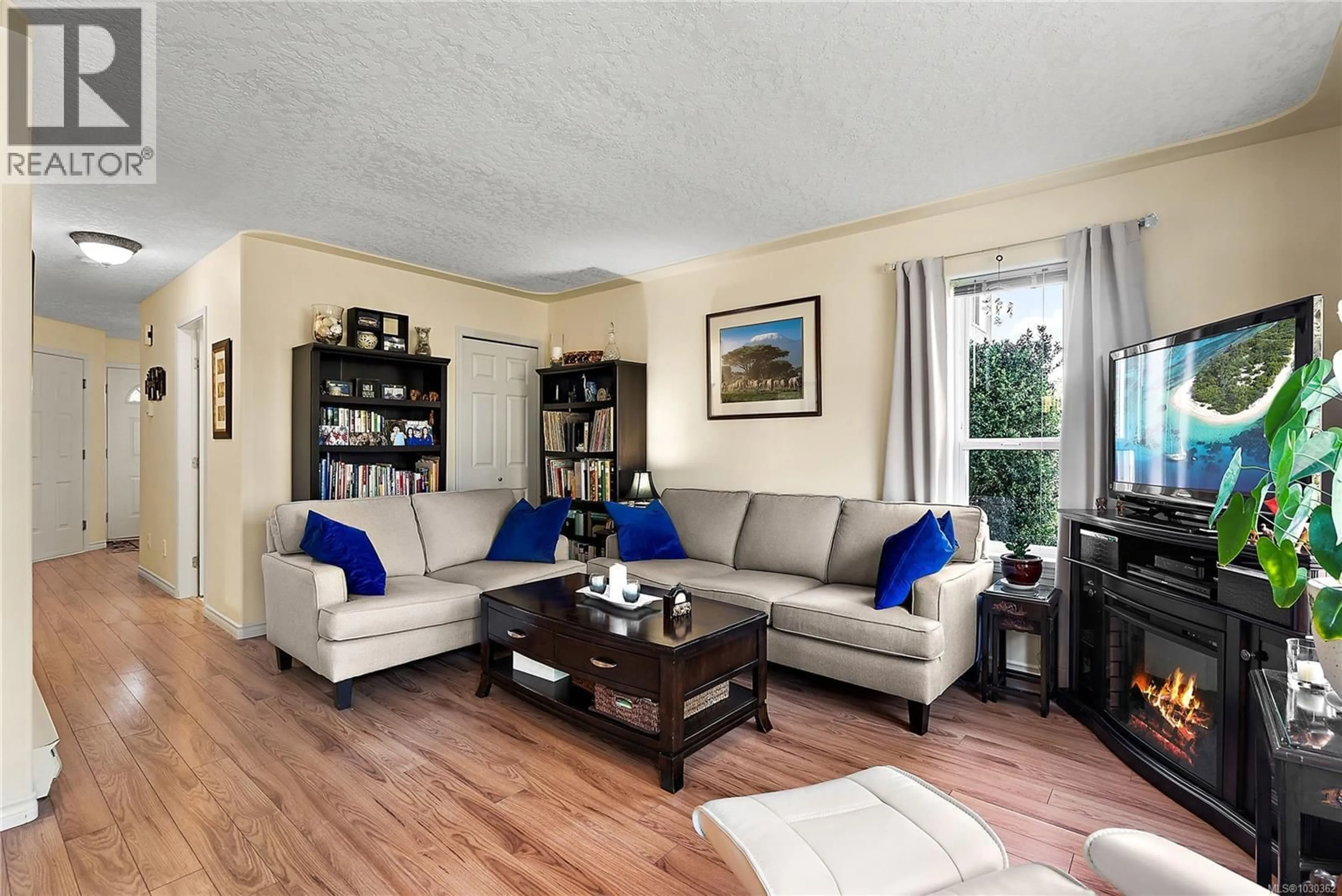 Living room with furniture, wood/laminate floor for 103 - 793 MEAFORD AVENUE, Langford British Columbia V9B2P7