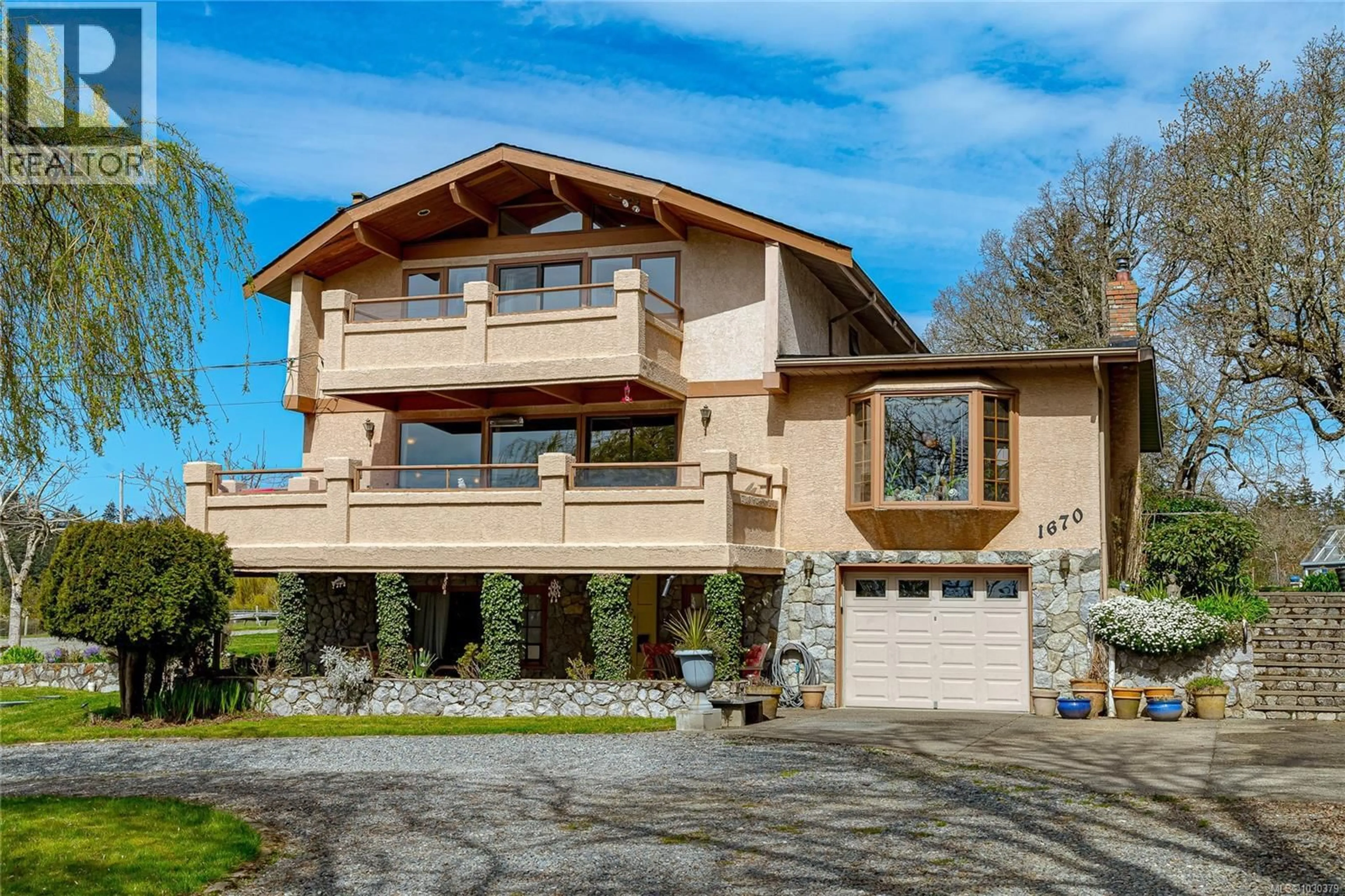 Home with vinyl exterior material, street for 1670 BURNSIDE ROAD WEST, Saanich British Columbia V8X3X3