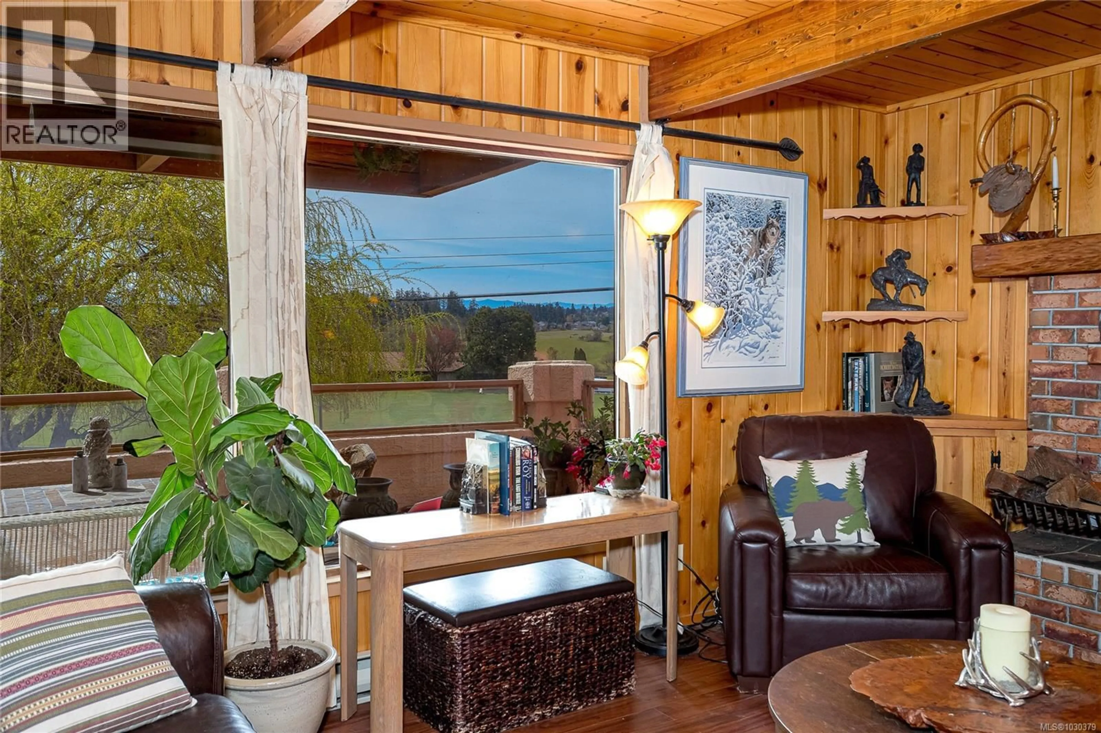 Living room with furniture, wood/laminate floor for 1670 BURNSIDE ROAD WEST, Saanich British Columbia V8X3X3