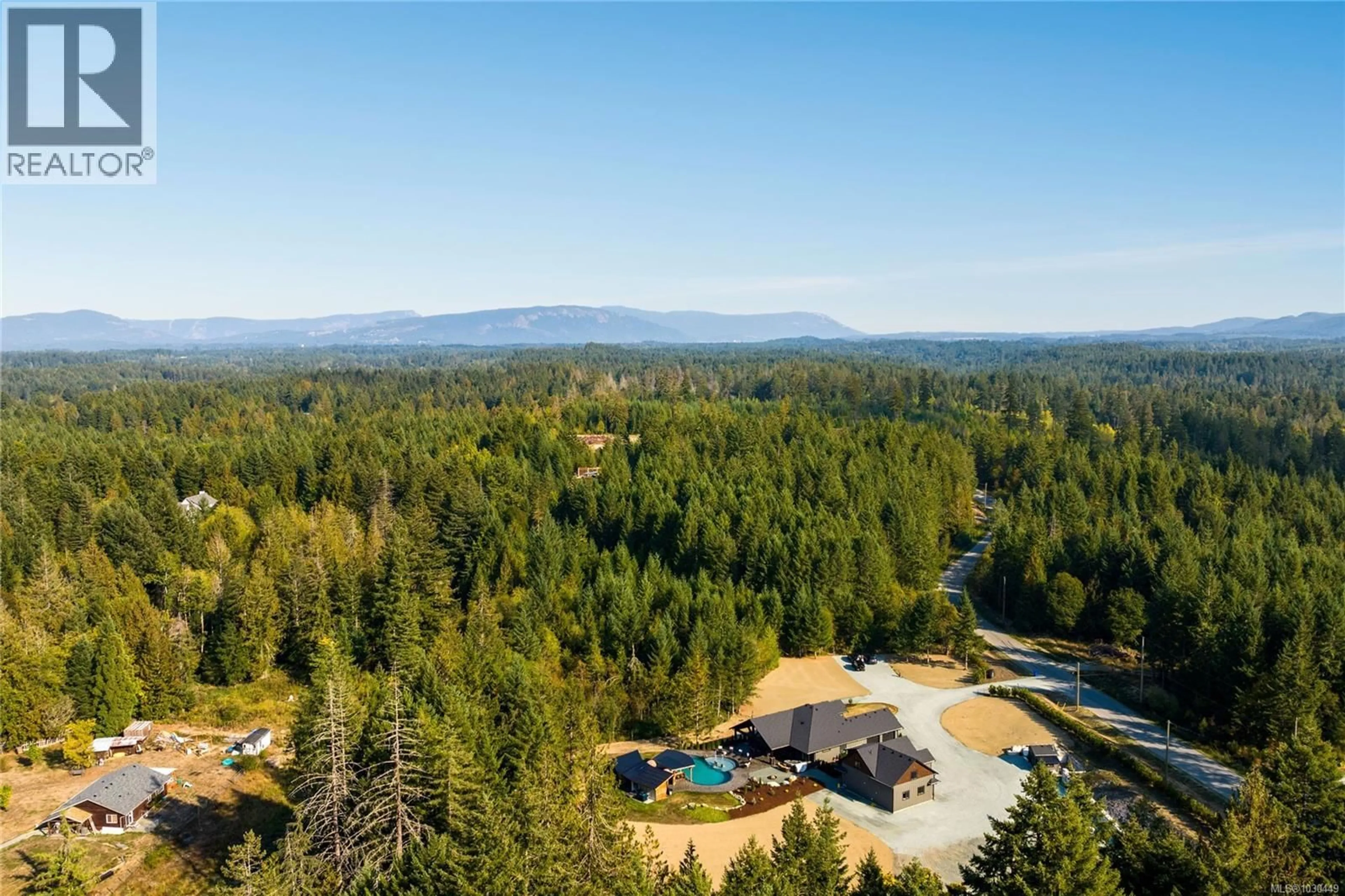 A pic from outside/outdoor area/front of a property/back of a property/a pic from drone, forest/trees view for 4725 APPALOOSA WAY, Duncan British Columbia V9L6J1