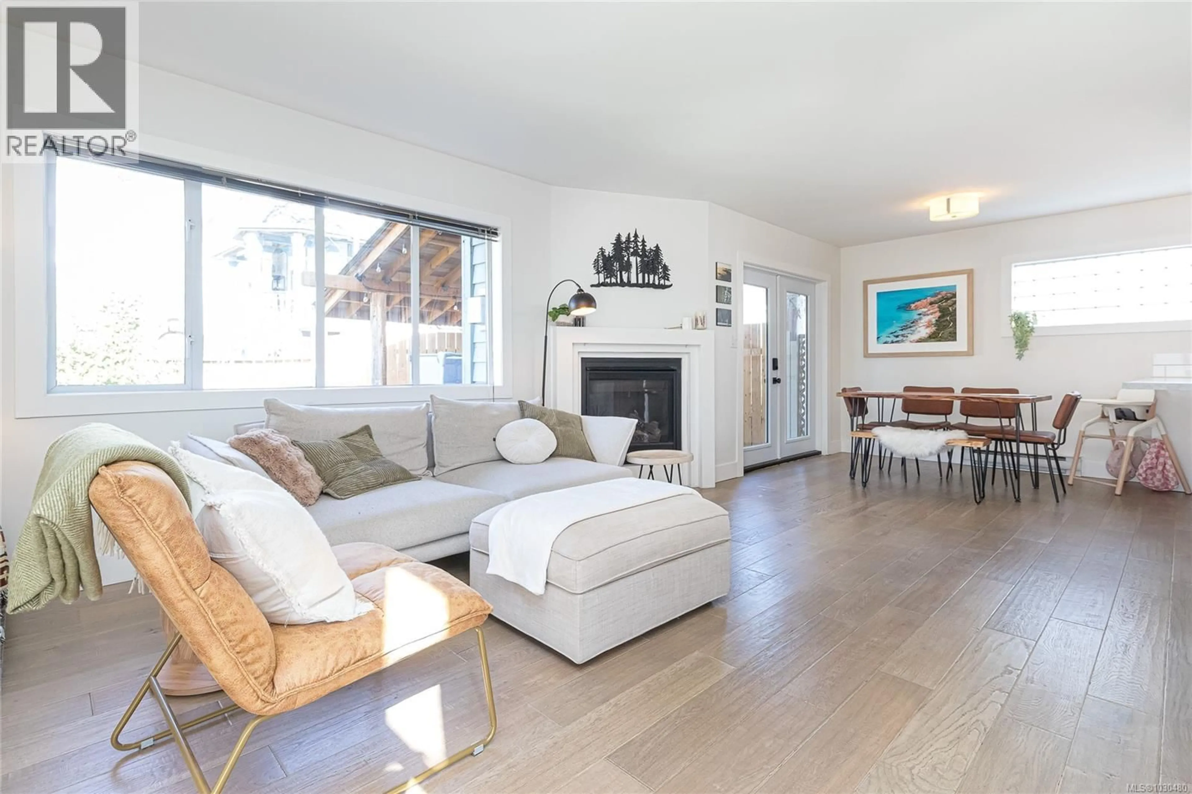Living room with furniture, wood/laminate floor for 211 HENRY STREET, Victoria British Columbia V9A3H8