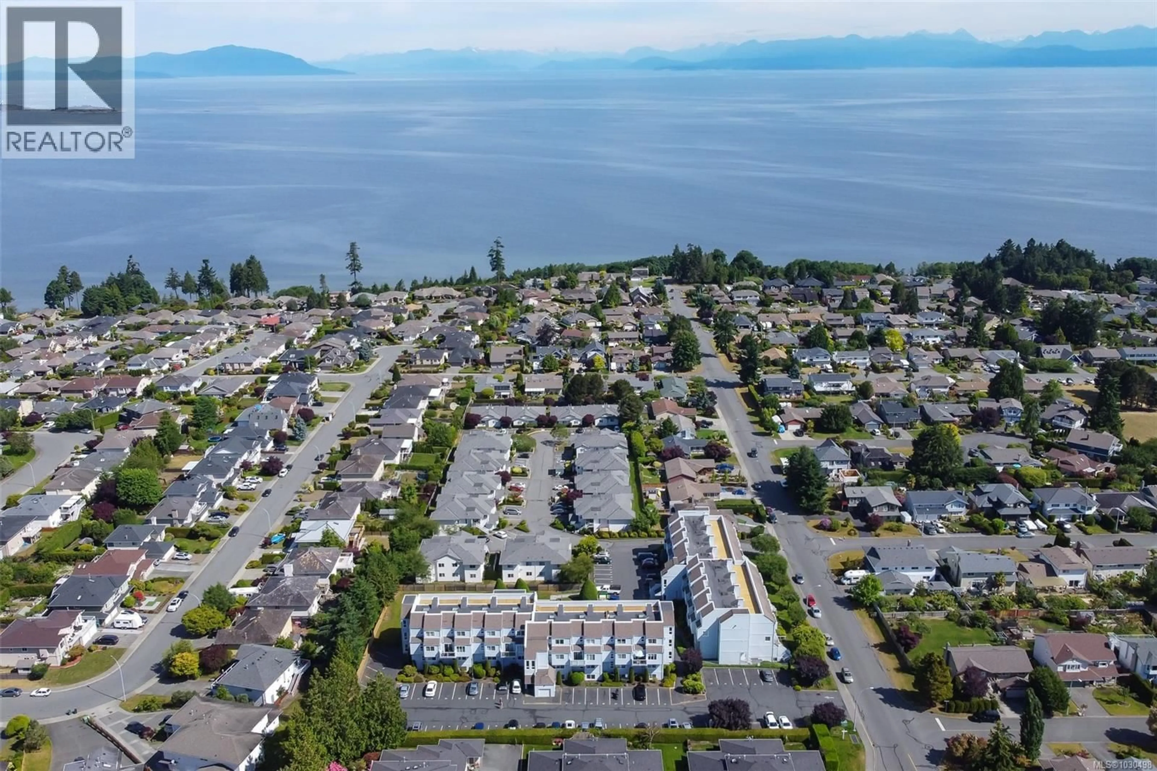 A pic from outside/outdoor area/front of a property/back of a property/a pic from drone, water/lake/river/ocean view for 102A - 6231 BLUEBACK ROAD, Nanaimo British Columbia V9V1J3