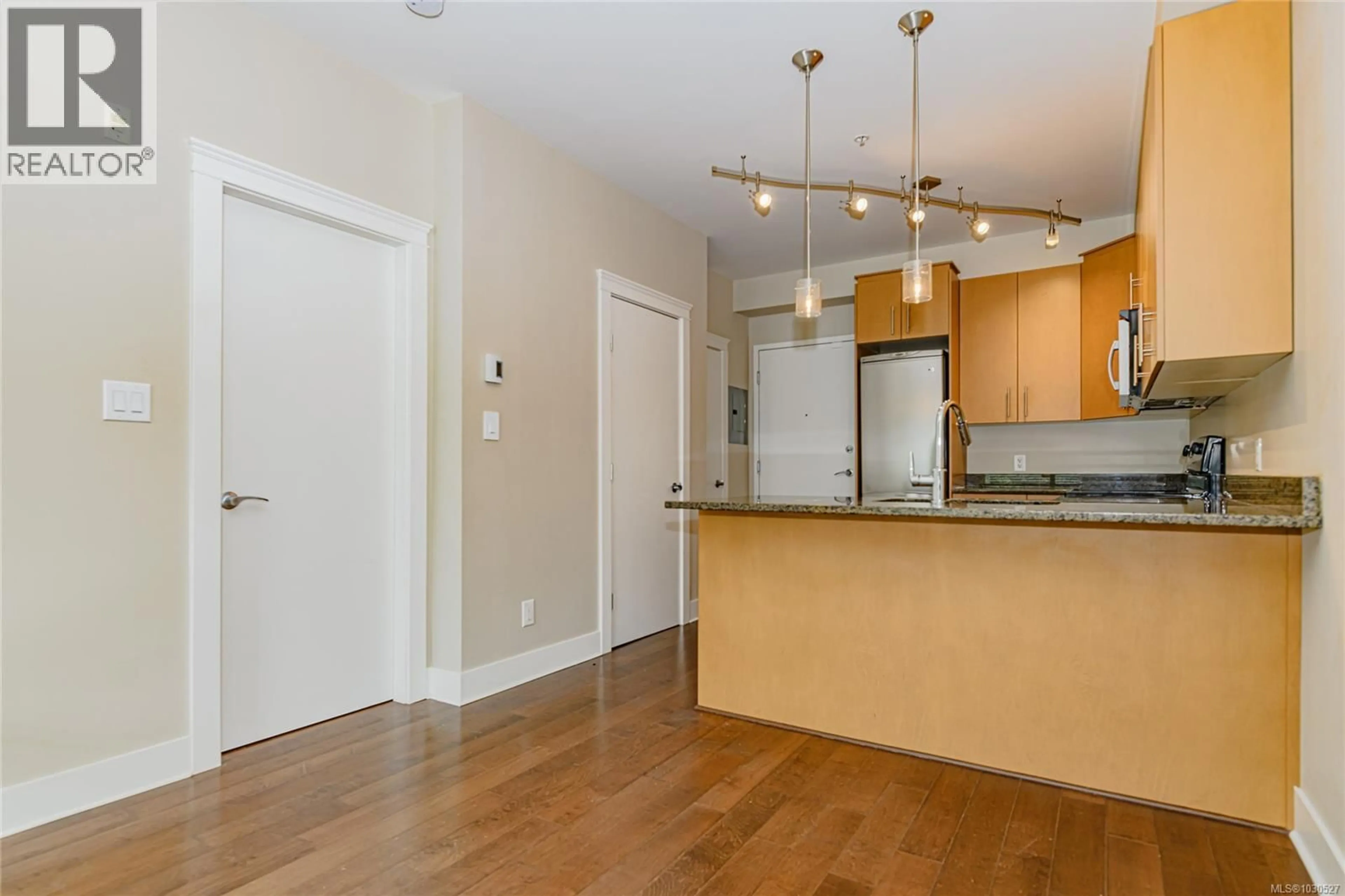 Open concept kitchen, wood/laminate floor for 214 - 21 CONARD STREET, View Royal British Columbia V8Z0C4