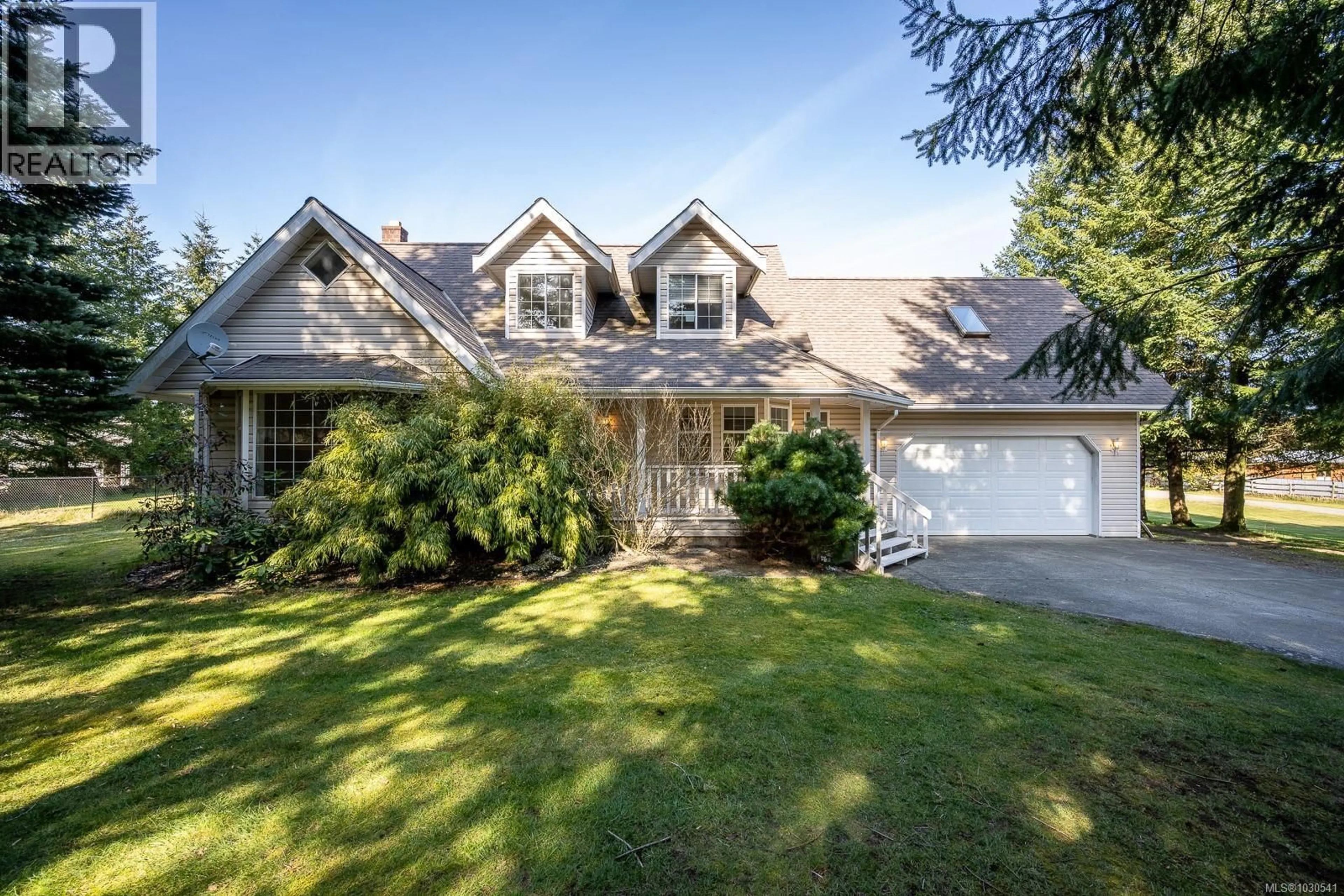 A pic from outside/outdoor area/front of a property/back of a property/a pic from drone, street for 6104 LEDINGHAM ROAD, Courtenay British Columbia V9J1M9