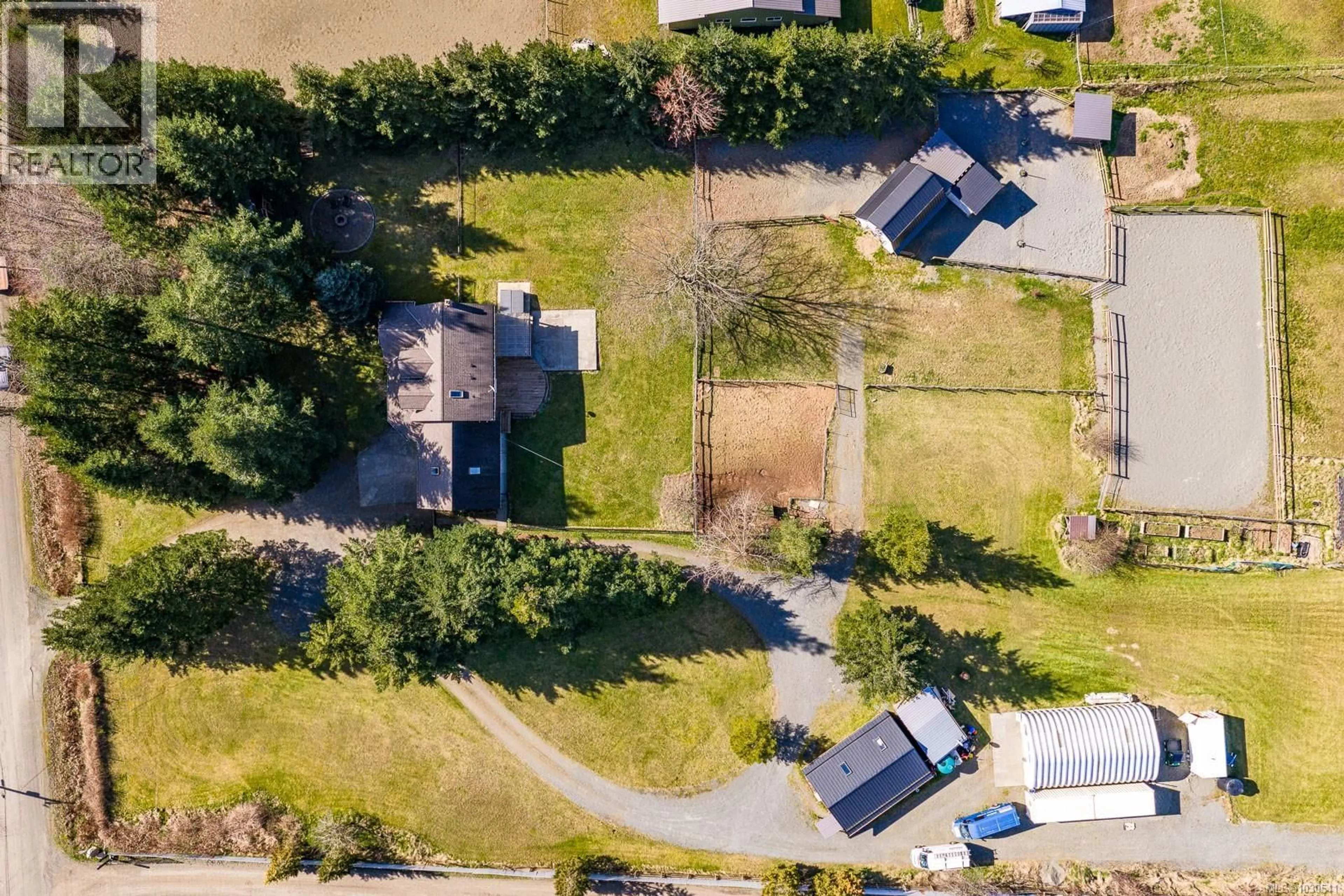 A pic from outside/outdoor area/front of a property/back of a property/a pic from drone, street for 6104 LEDINGHAM ROAD, Courtenay British Columbia V9J1M9