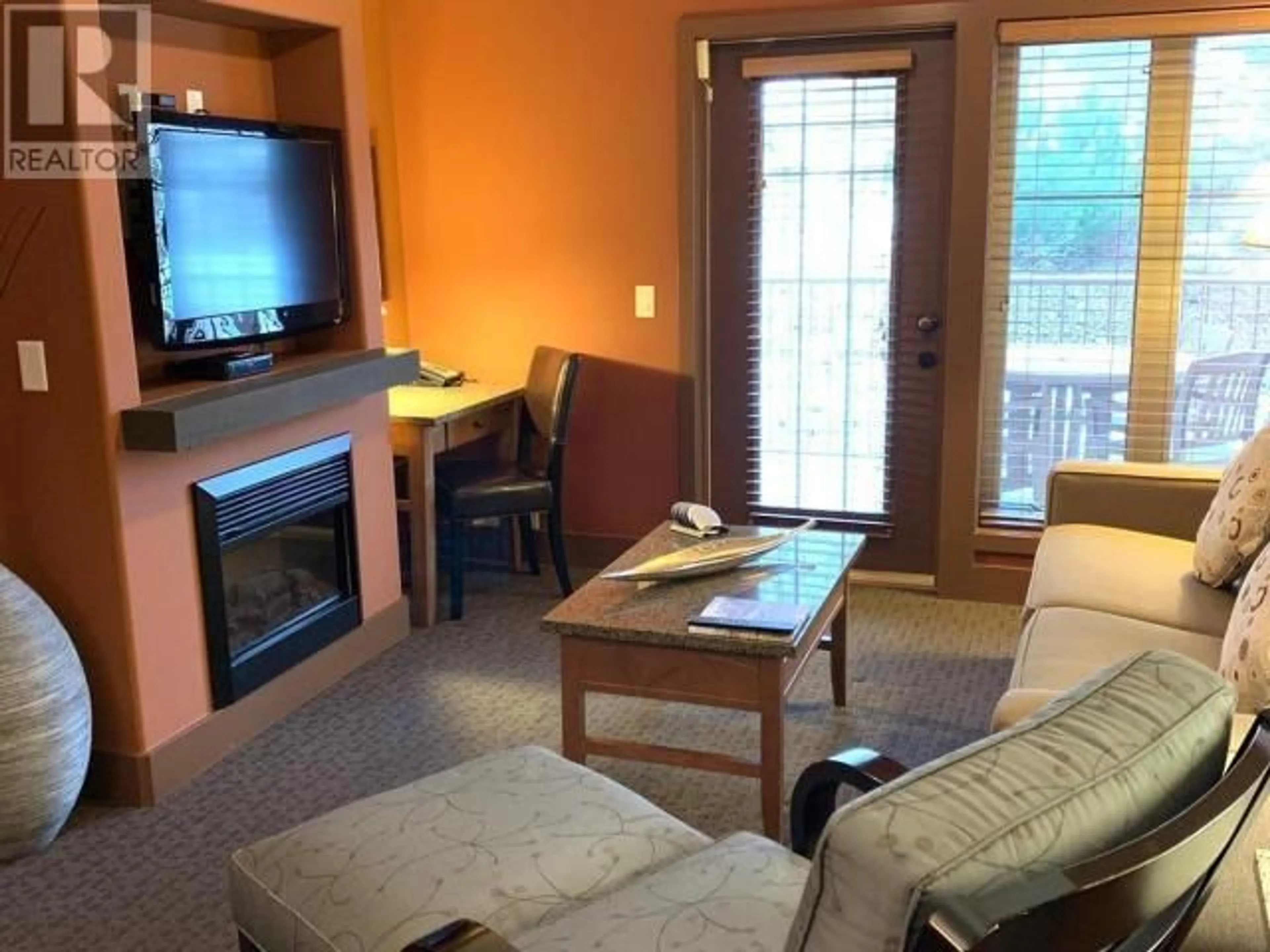 Living room with furniture, wood/laminate floor for 434C - 1200 RANCHER CREEK ROAD, Osoyoos British Columbia V0H1V6