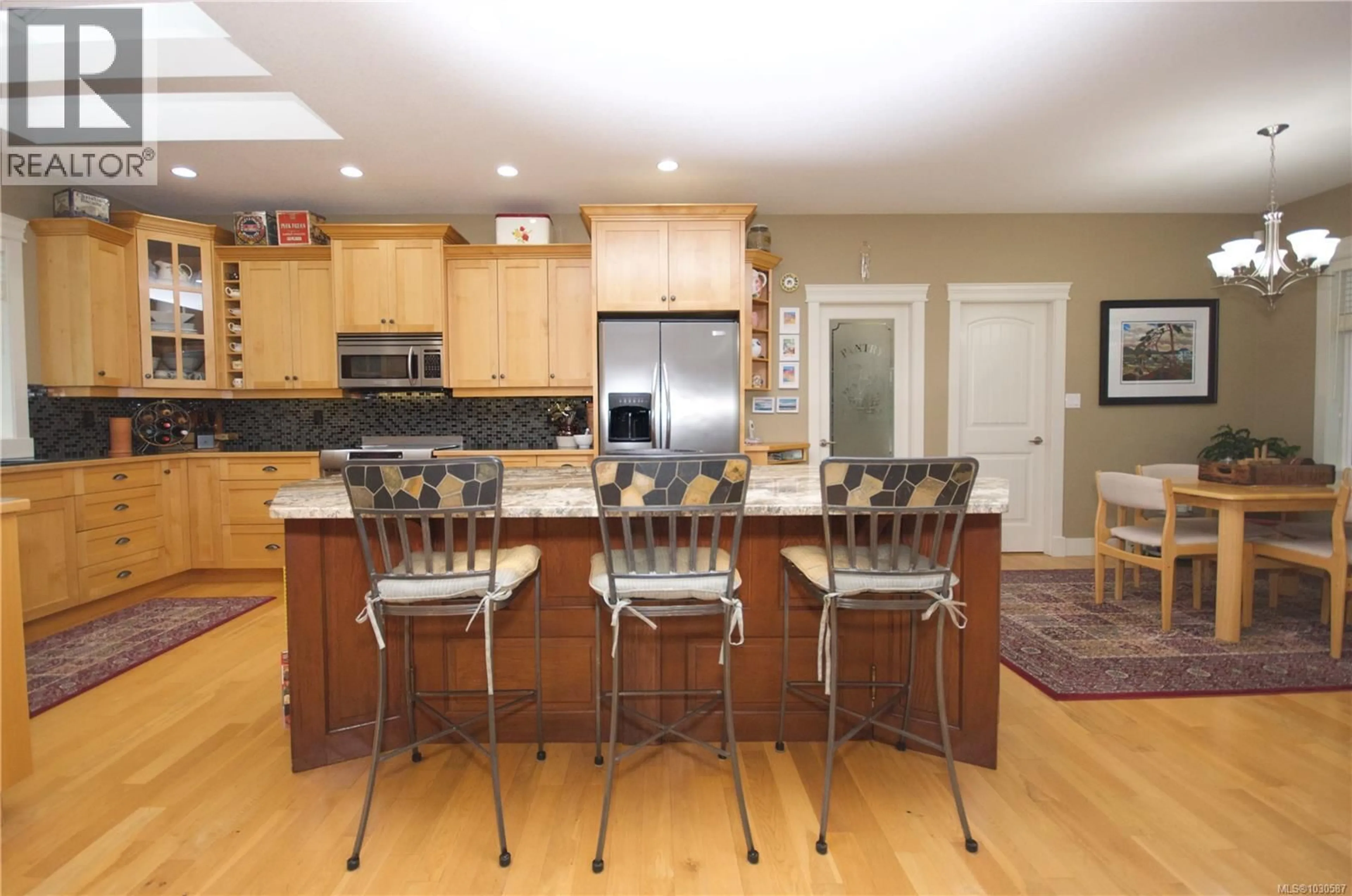 Open concept kitchen, wood/laminate floor for 2040 SUN KING ROAD, Coombs British Columbia V0R1M0