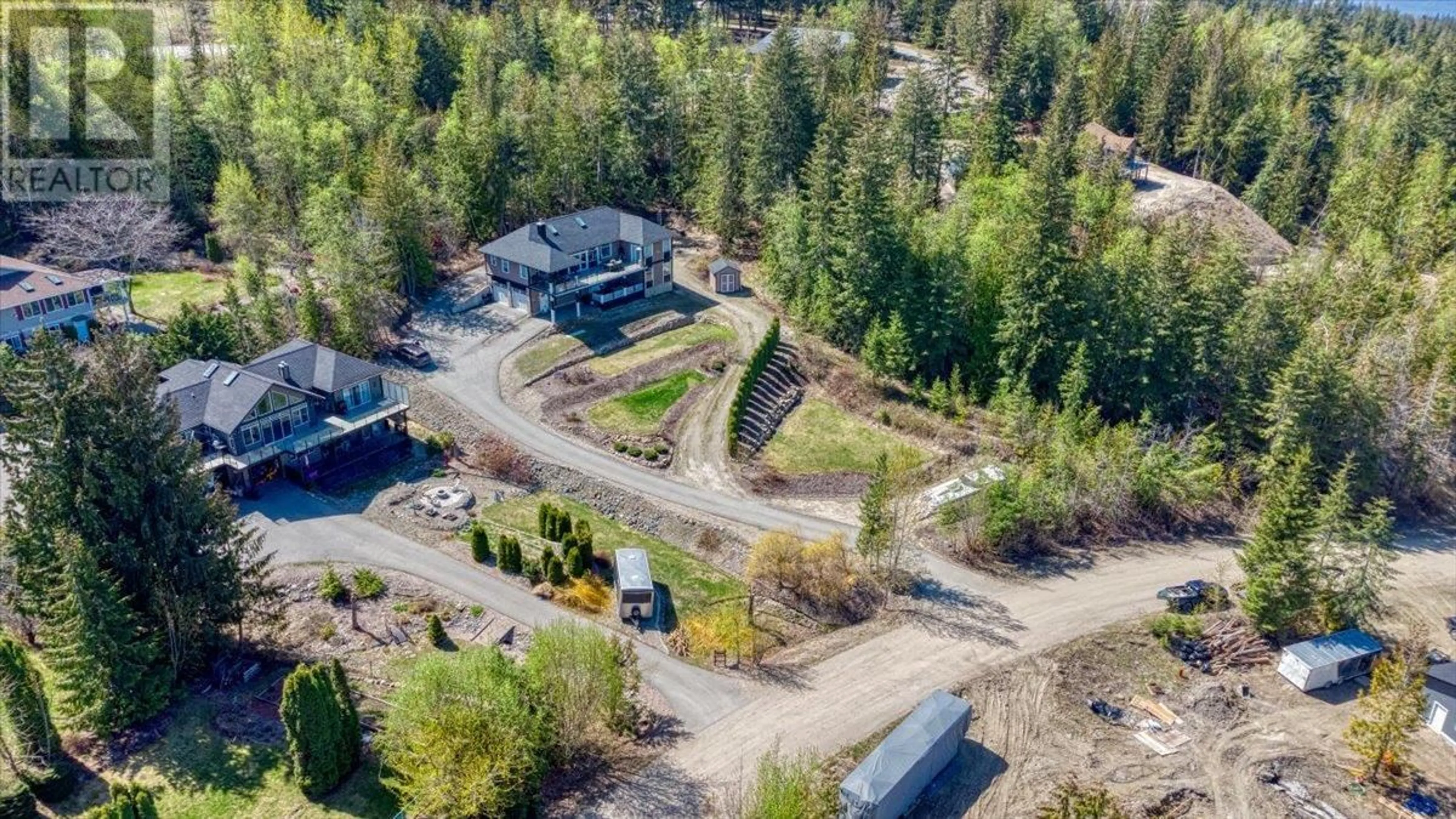 A pic from exterior of the house or condo, the fenced backyard for 2127 Pleasant Dale Road W, Blind Bay British Columbia V0E2W1