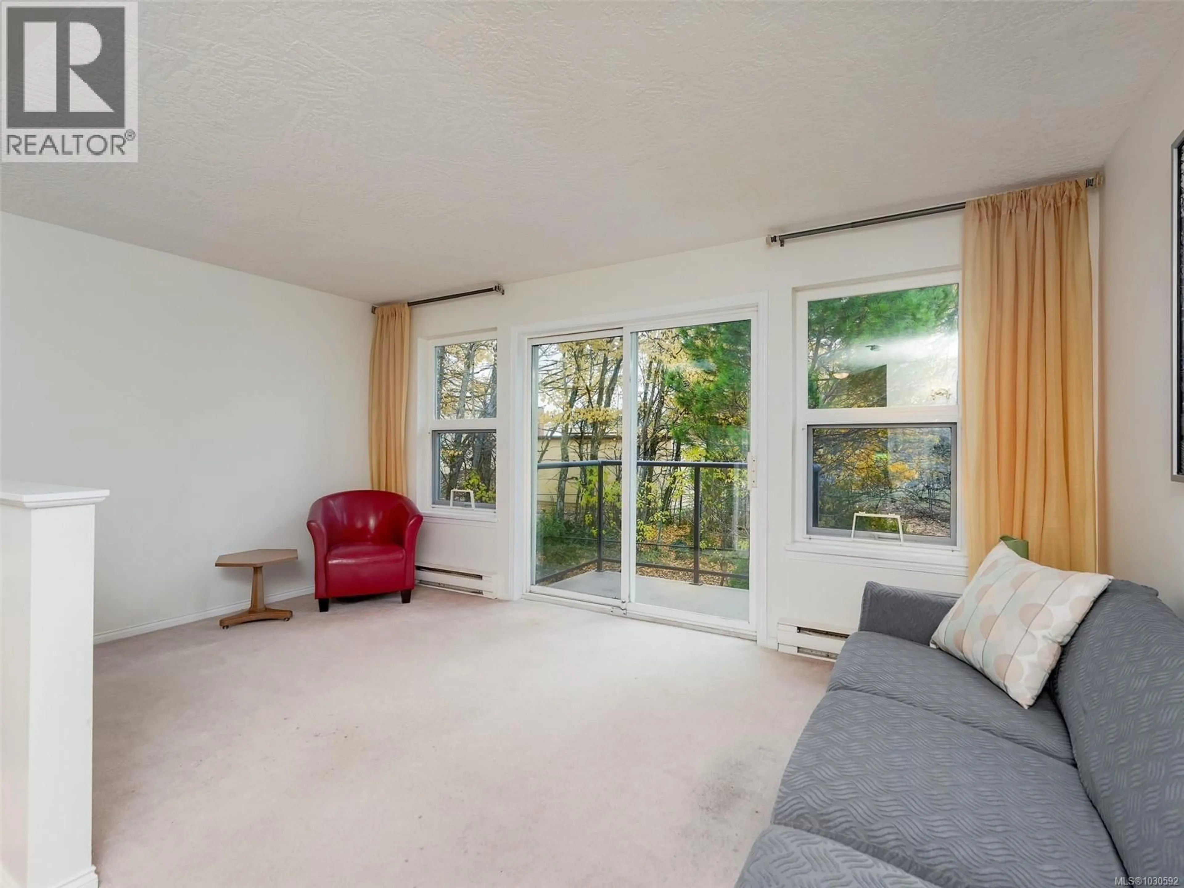 Living room with furniture, unknown for 213 - 1485 GARNET ROAD, Saanich British Columbia V8P5T5