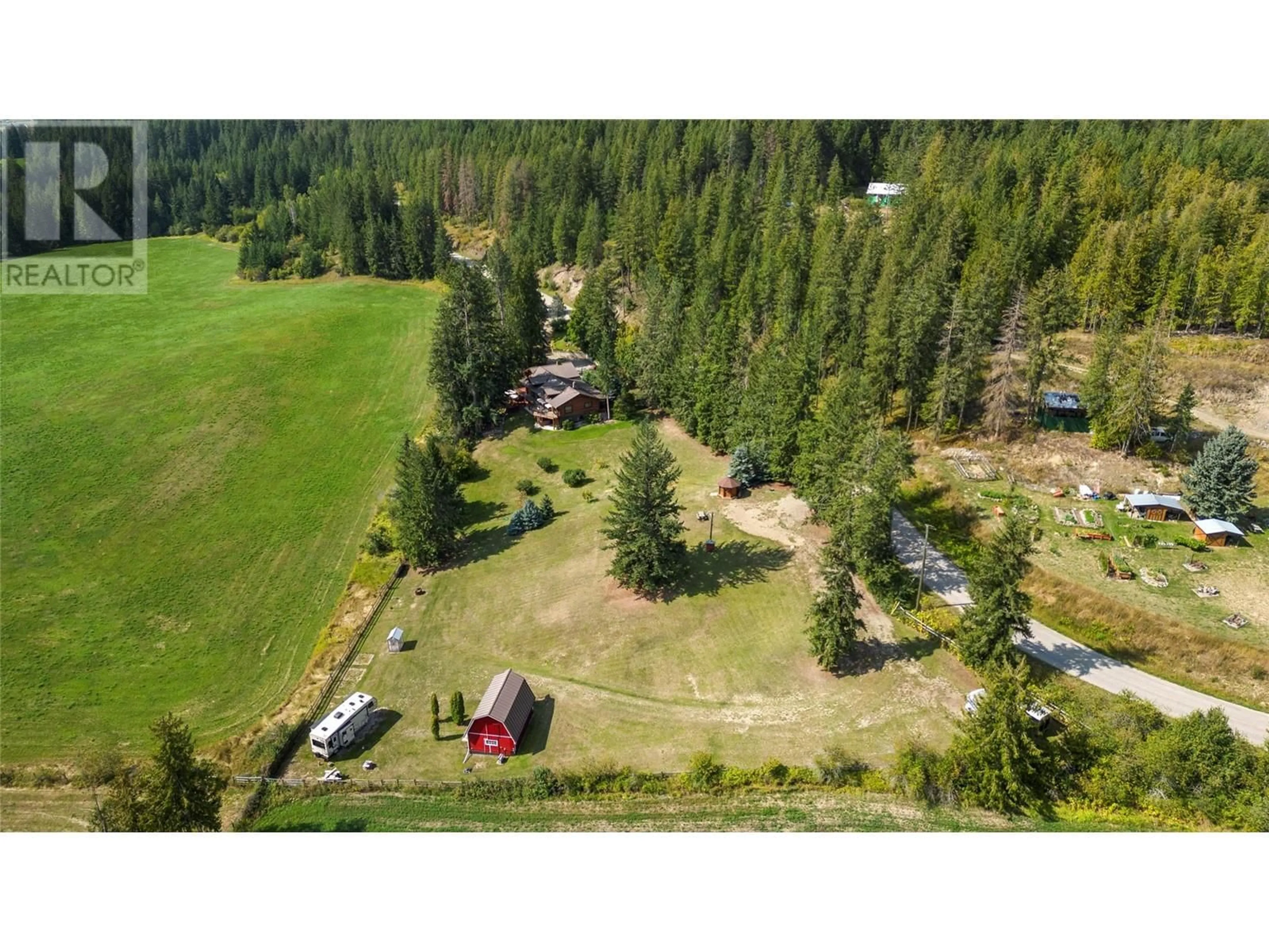A pic from outside/outdoor area/front of a property/back of a property/a pic from drone, forest/trees view for 3755 WHITE LAKE ROAD, Tappen British Columbia V0E2W0
