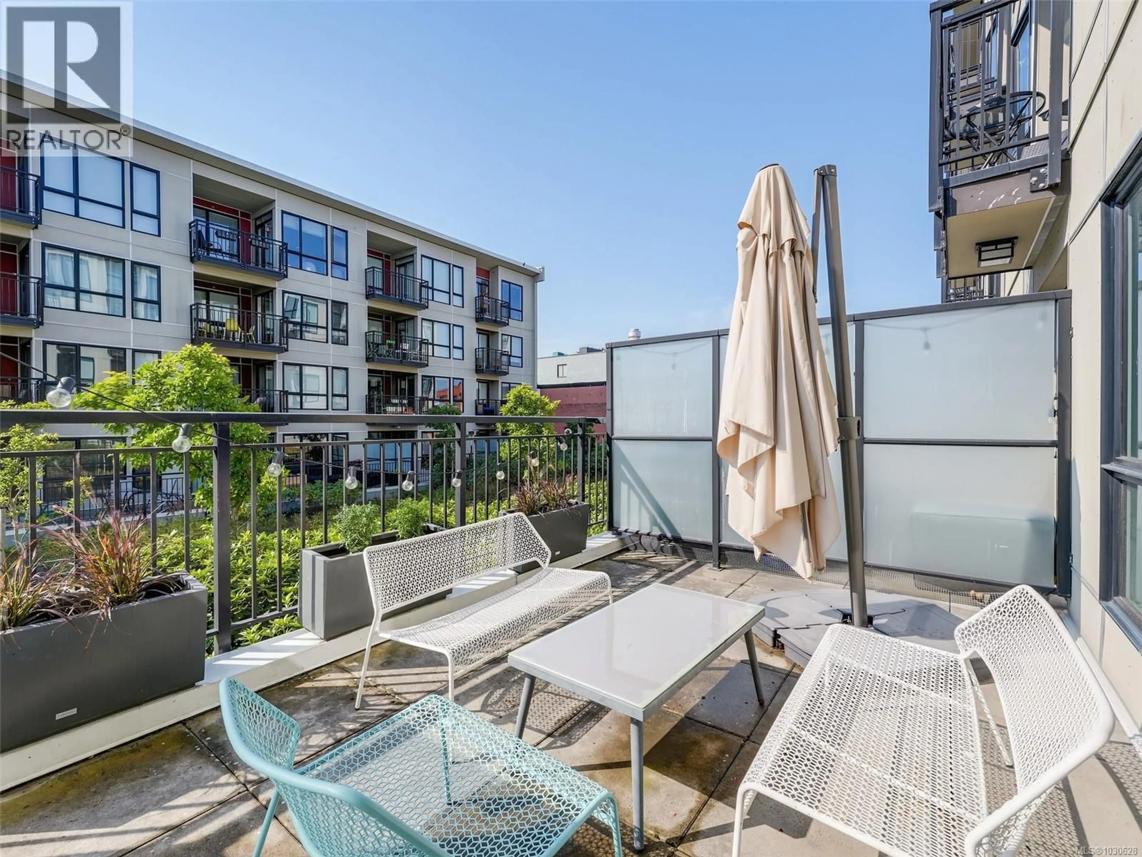 Patio, city buildings view from balcony for 215 - 517 FISGARD STREET, Victoria British Columbia V8W0C5