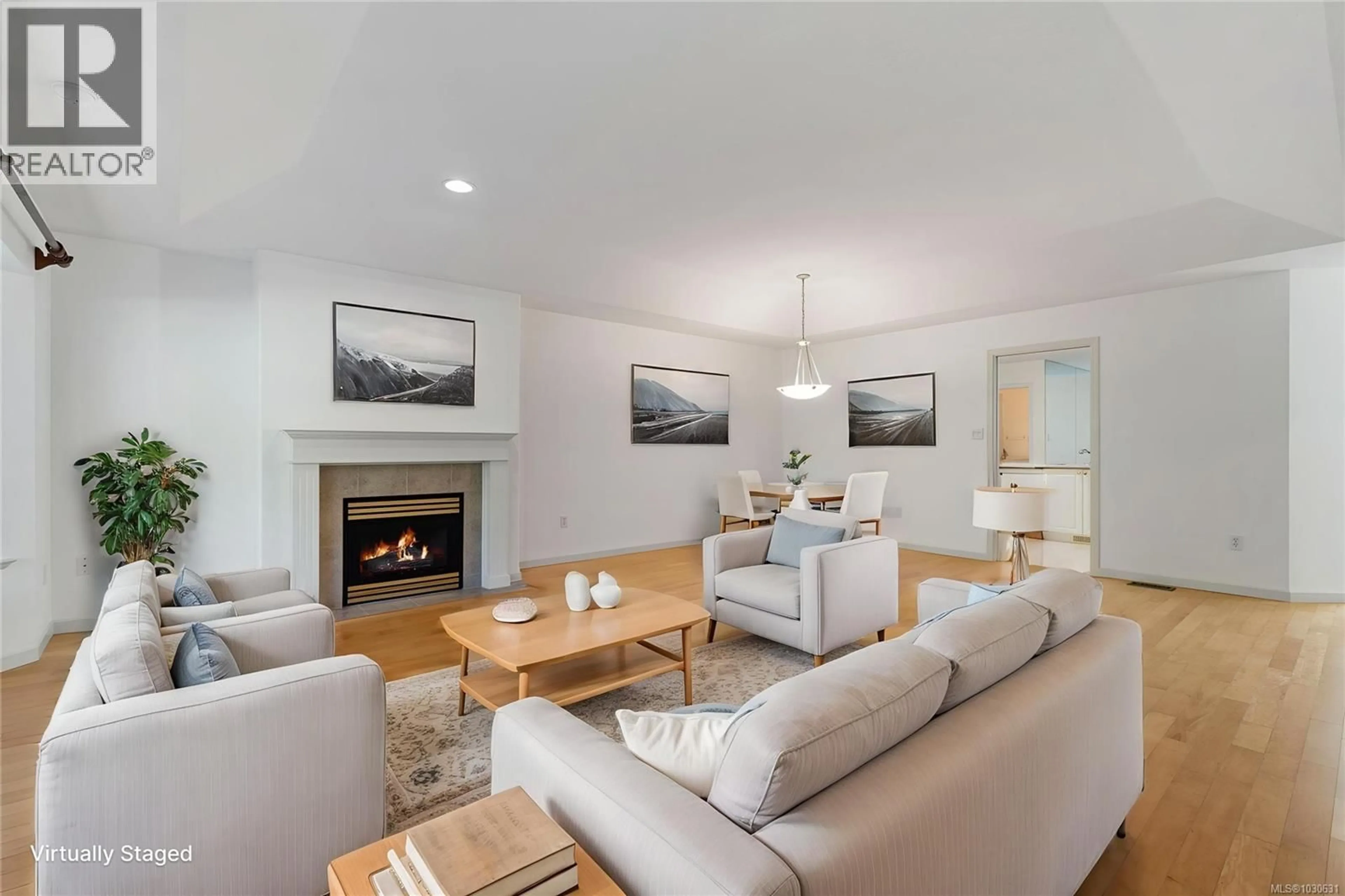 Living room with furniture, wood/laminate floor for 1 - 850 ARBUTUS STREET, Qualicum Beach British Columbia V9K2M7