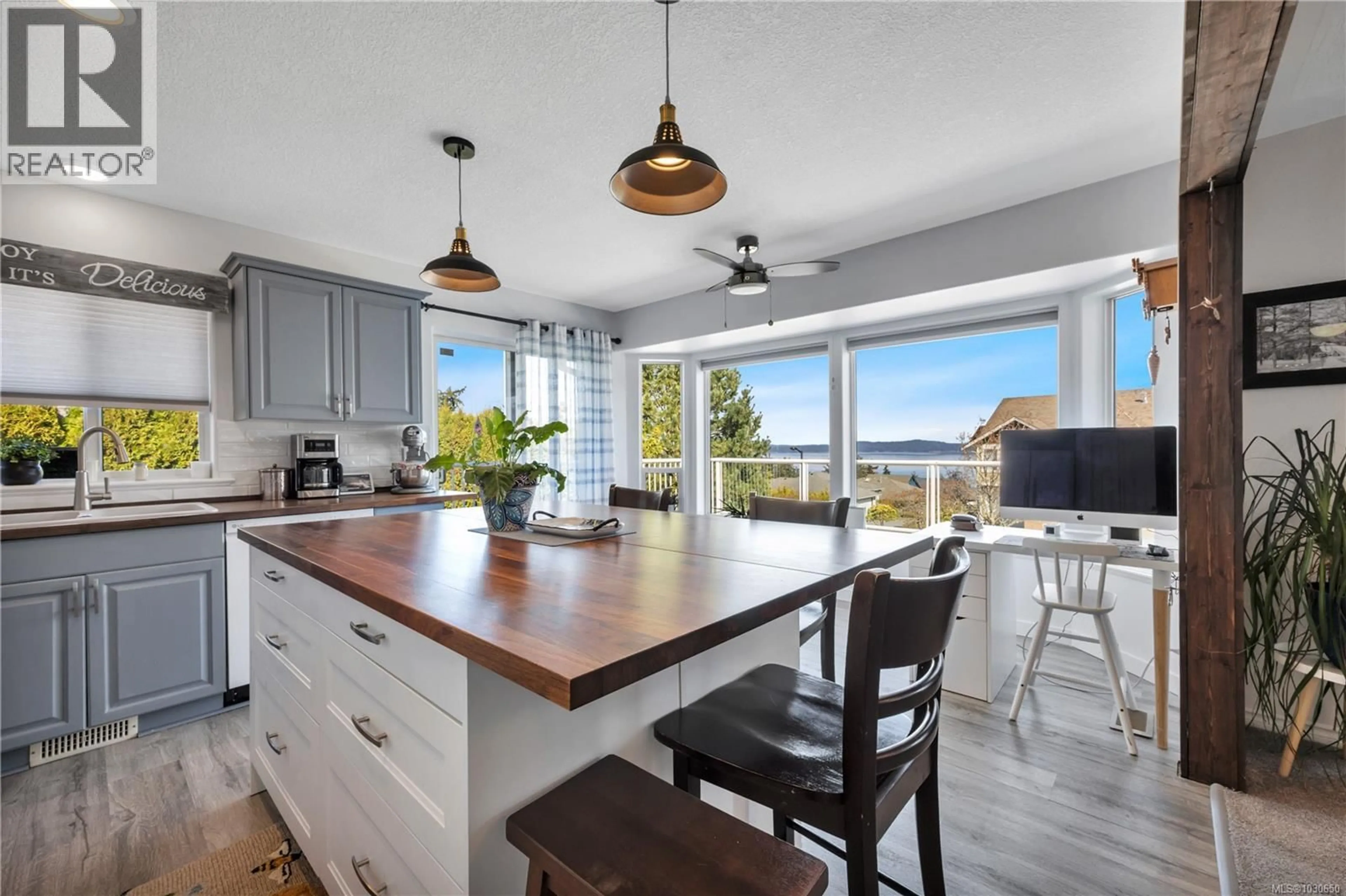 Open concept kitchen, wood/laminate floor for 402 TASSIN PLACE, Ladysmith British Columbia V9G1W8