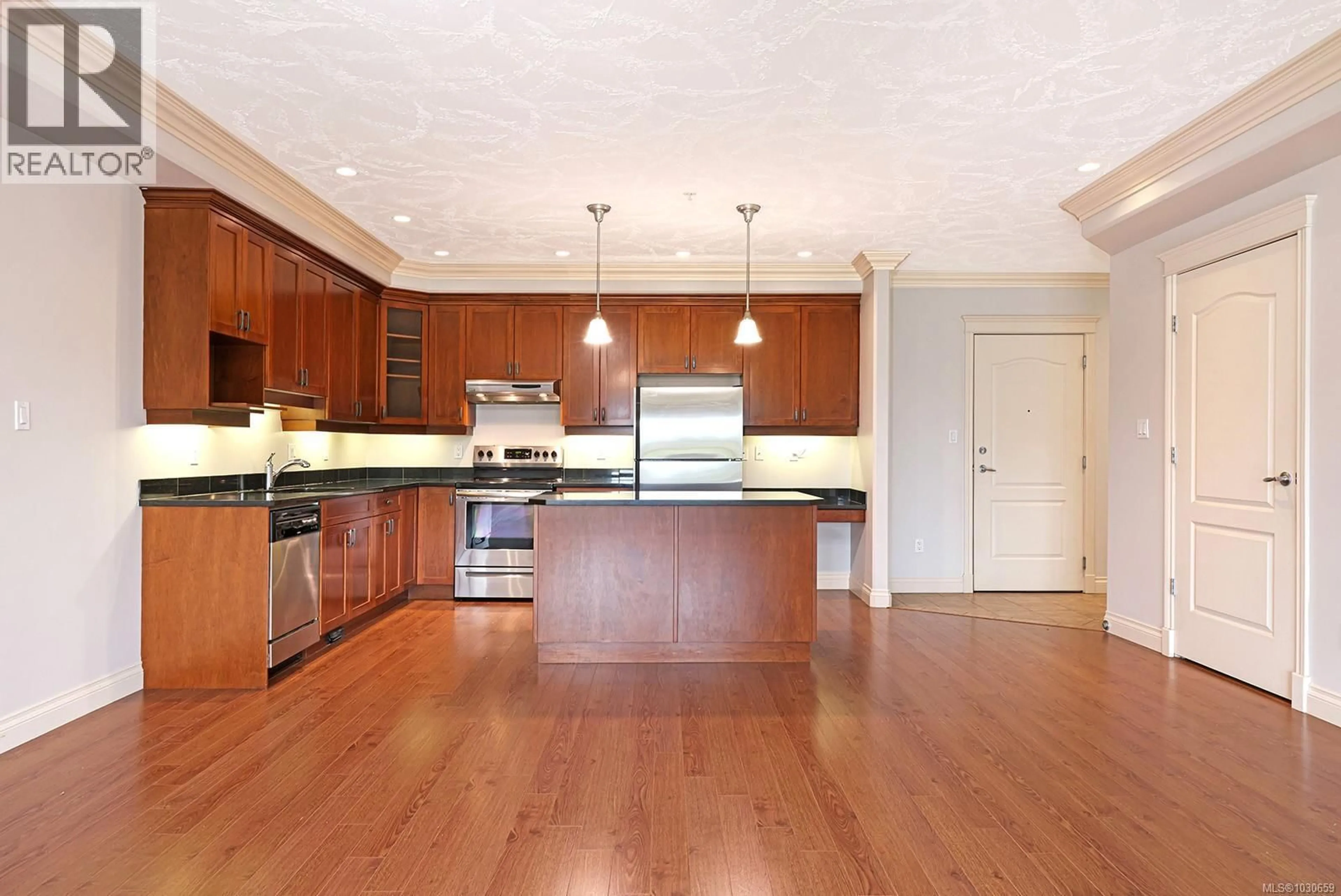 Open concept kitchen, wood/laminate floor for 323 - 3666 ROYAL VISTA WAY, Courtenay British Columbia V9N9X8