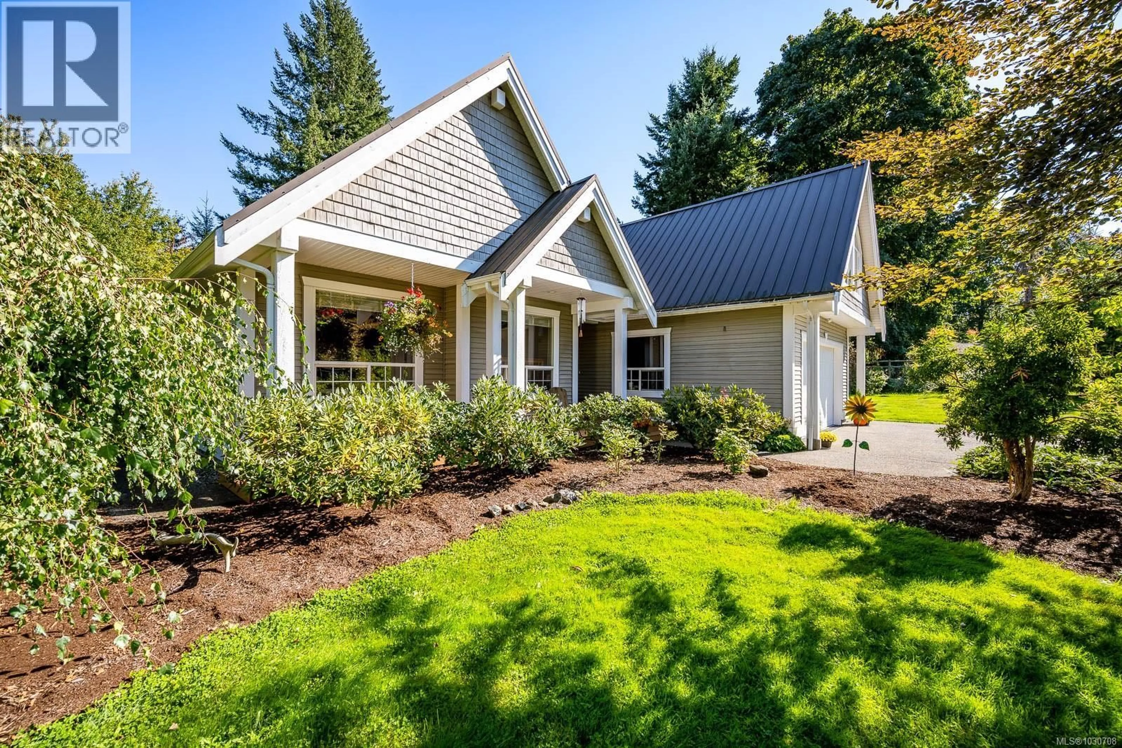 Home with vinyl exterior material, street for 2435 CHARLEVILLE ROAD, Campbell River British Columbia V9W4N4