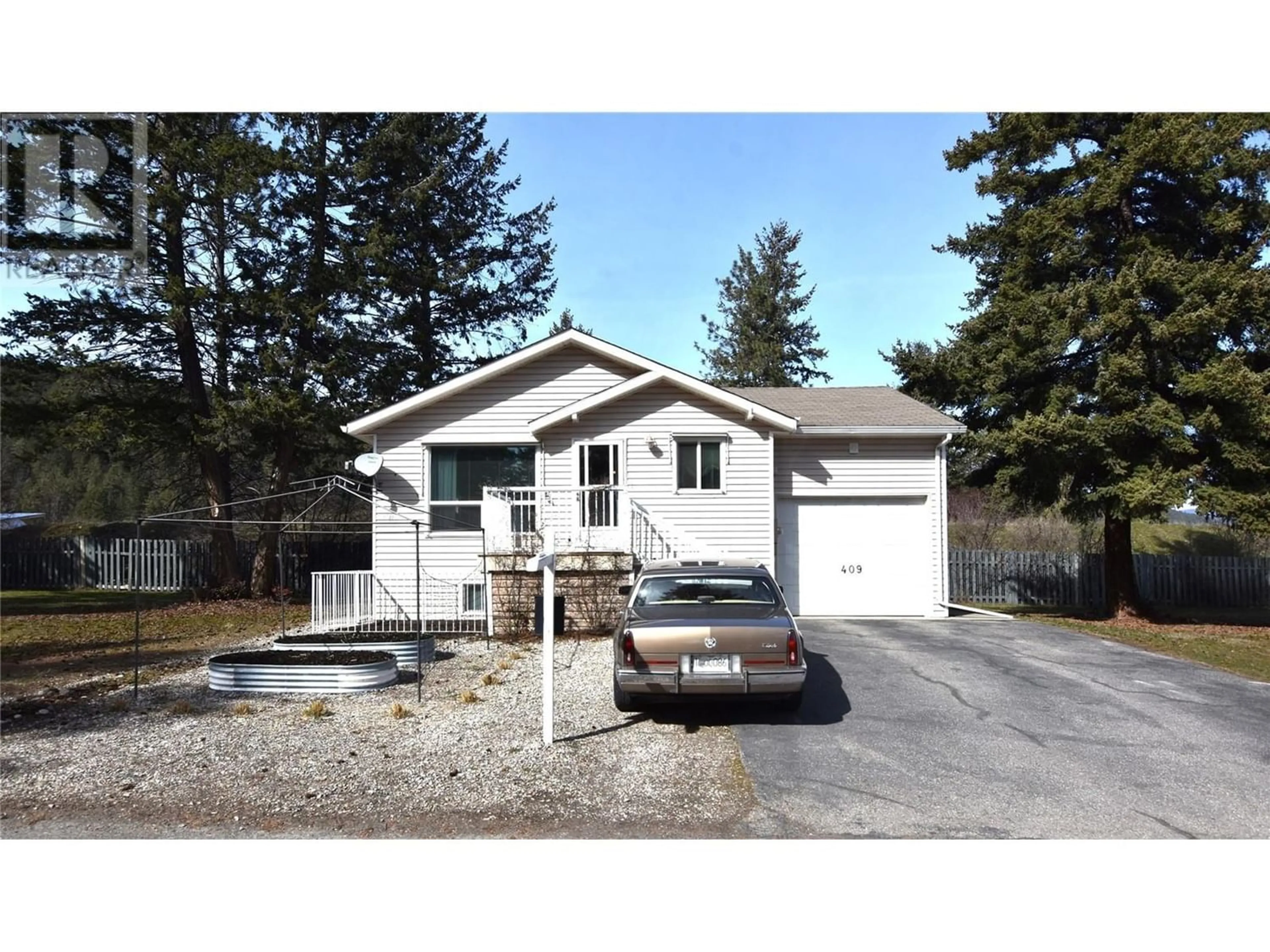 Frontside or backside of a home for 409 Hummingbird Avenue, Vernon British Columbia V1H2A1