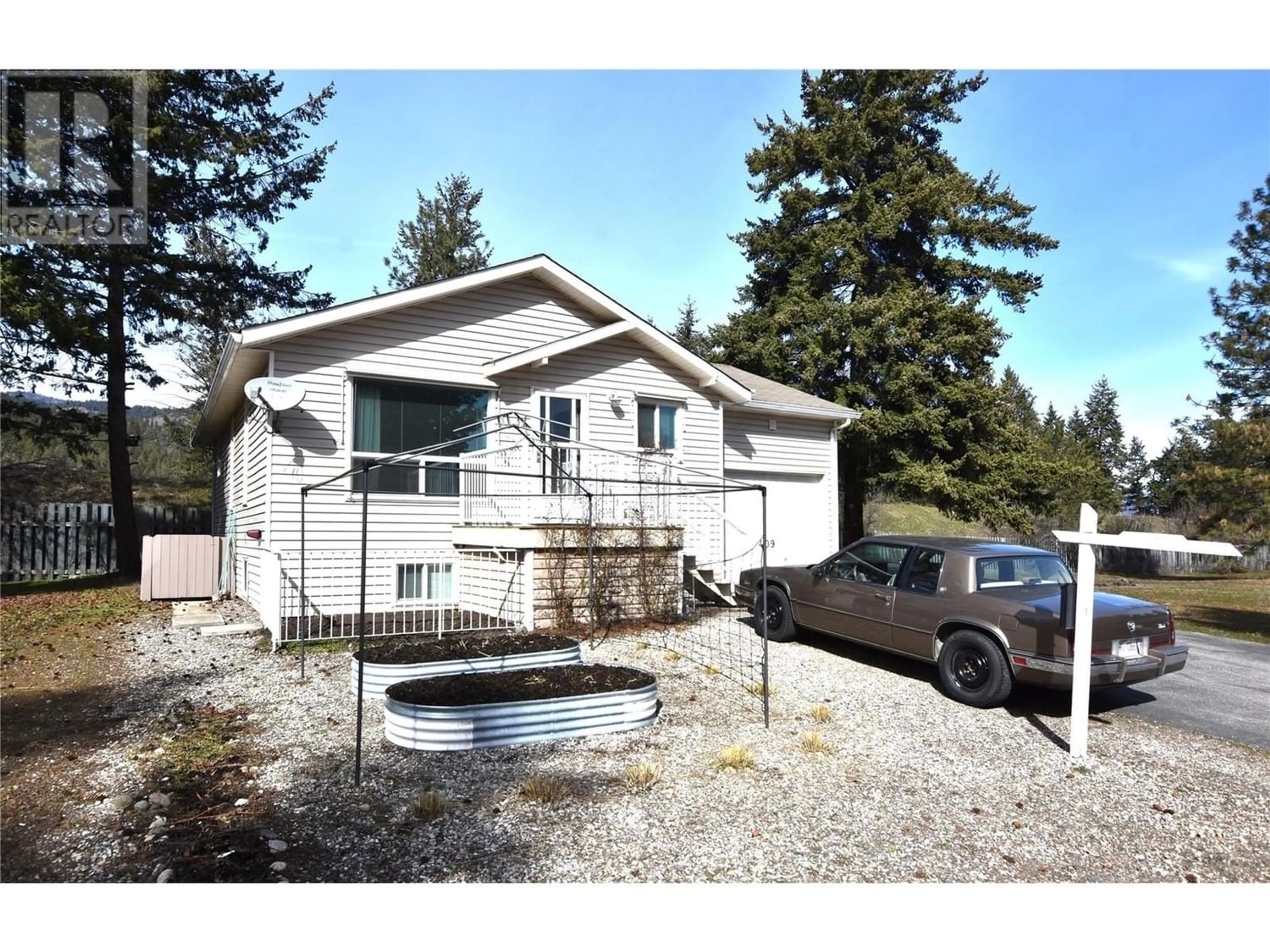 Frontside or backside of a home for 409 Hummingbird Avenue, Vernon British Columbia V1H2A1