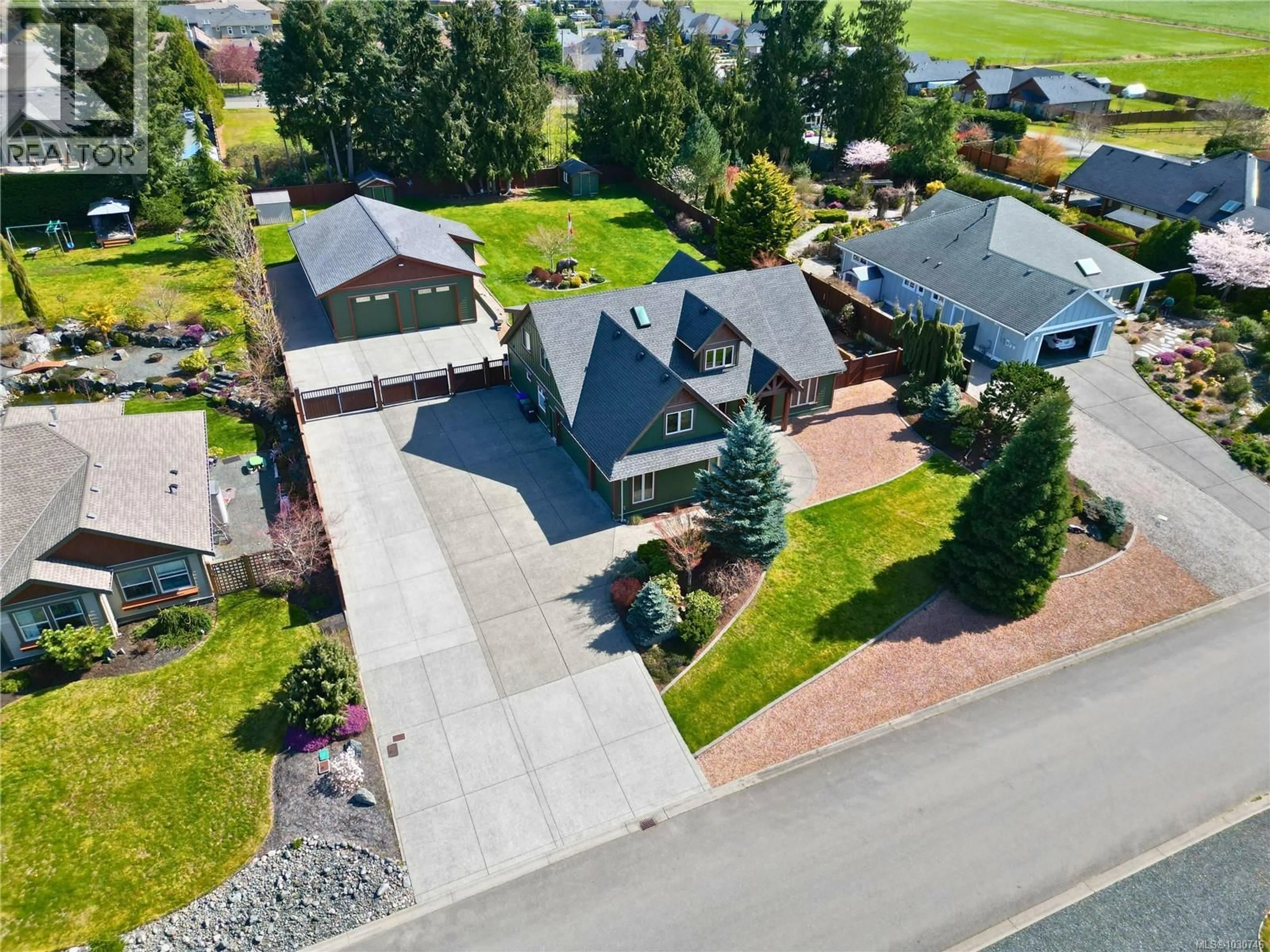 A pic from outside/outdoor area/front of a property/back of a property/a pic from drone, street for 1520 STONE LAKE DRIVE, Nanoose Bay British Columbia V9P9M6