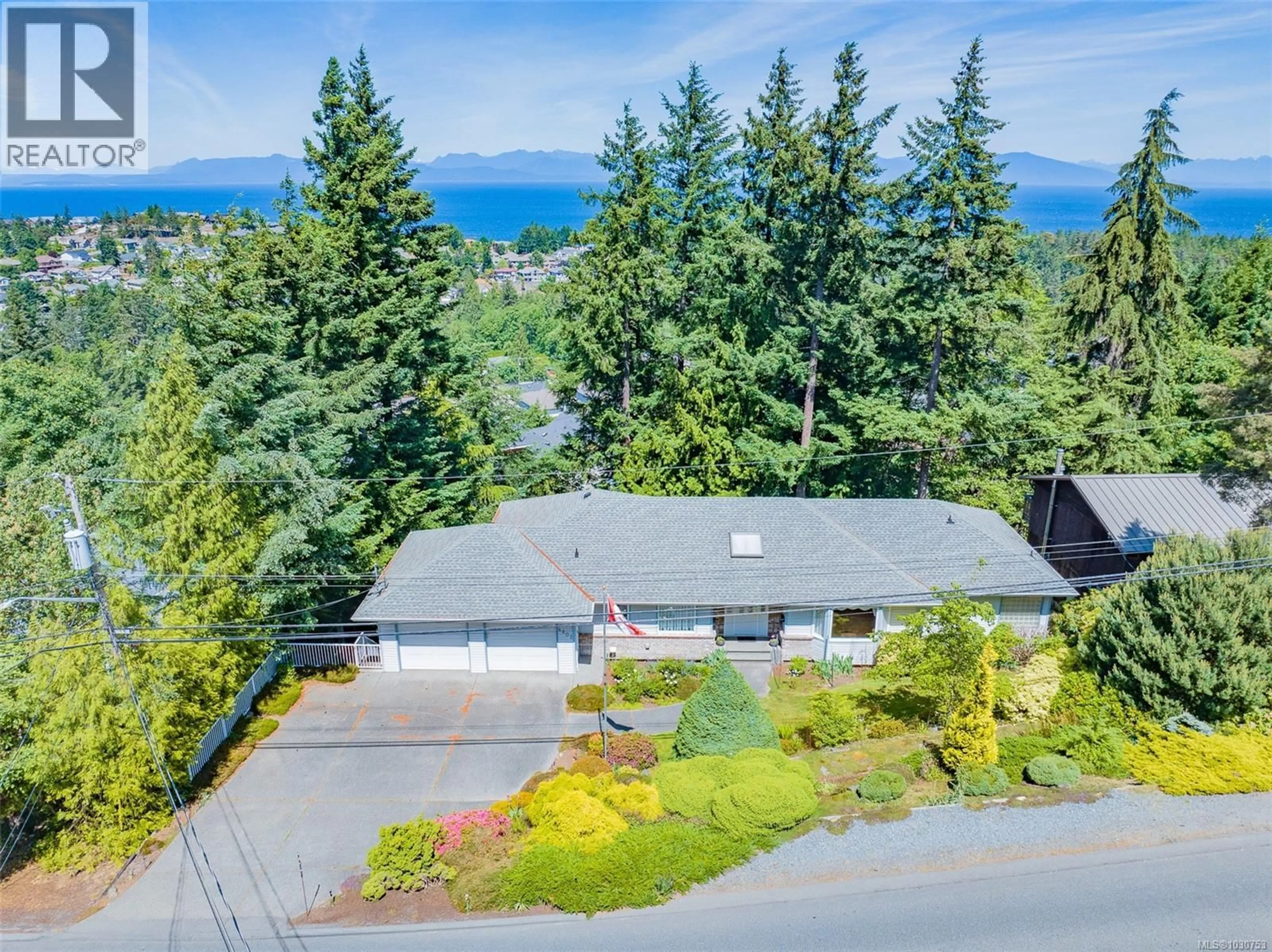 A pic from outside/outdoor area/front of a property/back of a property/a pic from drone, mountain view for 4802 LAGUNA WAY, Nanaimo British Columbia V9T1K5