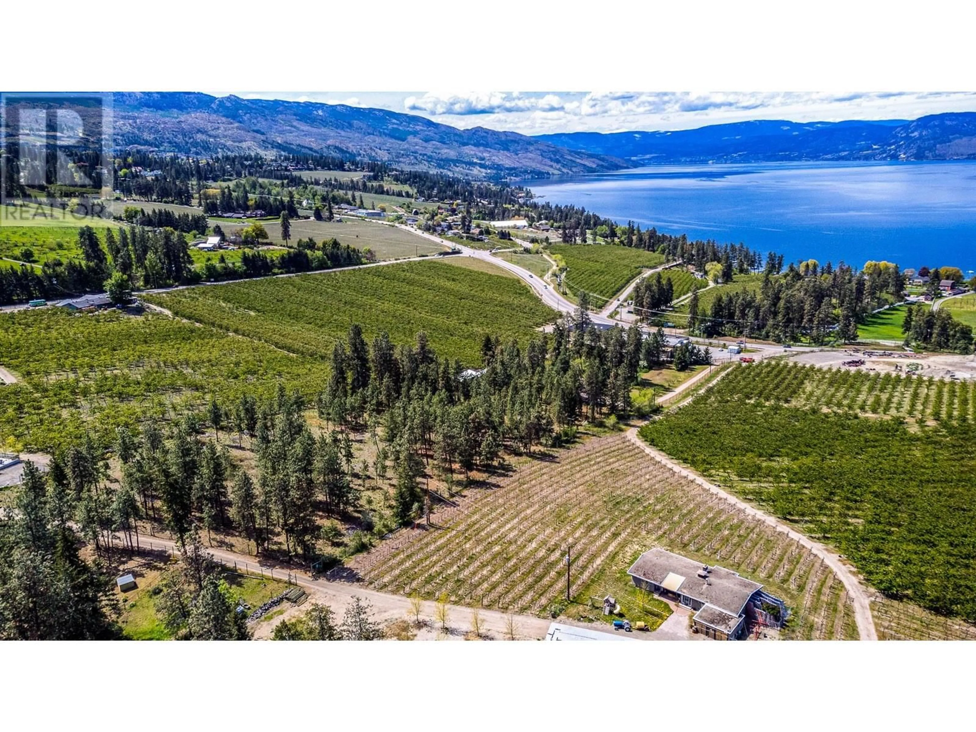 A pic from outside/outdoor area/front of a property/back of a property/a pic from drone, water/lake/river/ocean view for 4729 LAKESHORE ROAD, Kelowna British Columbia V1W4H6