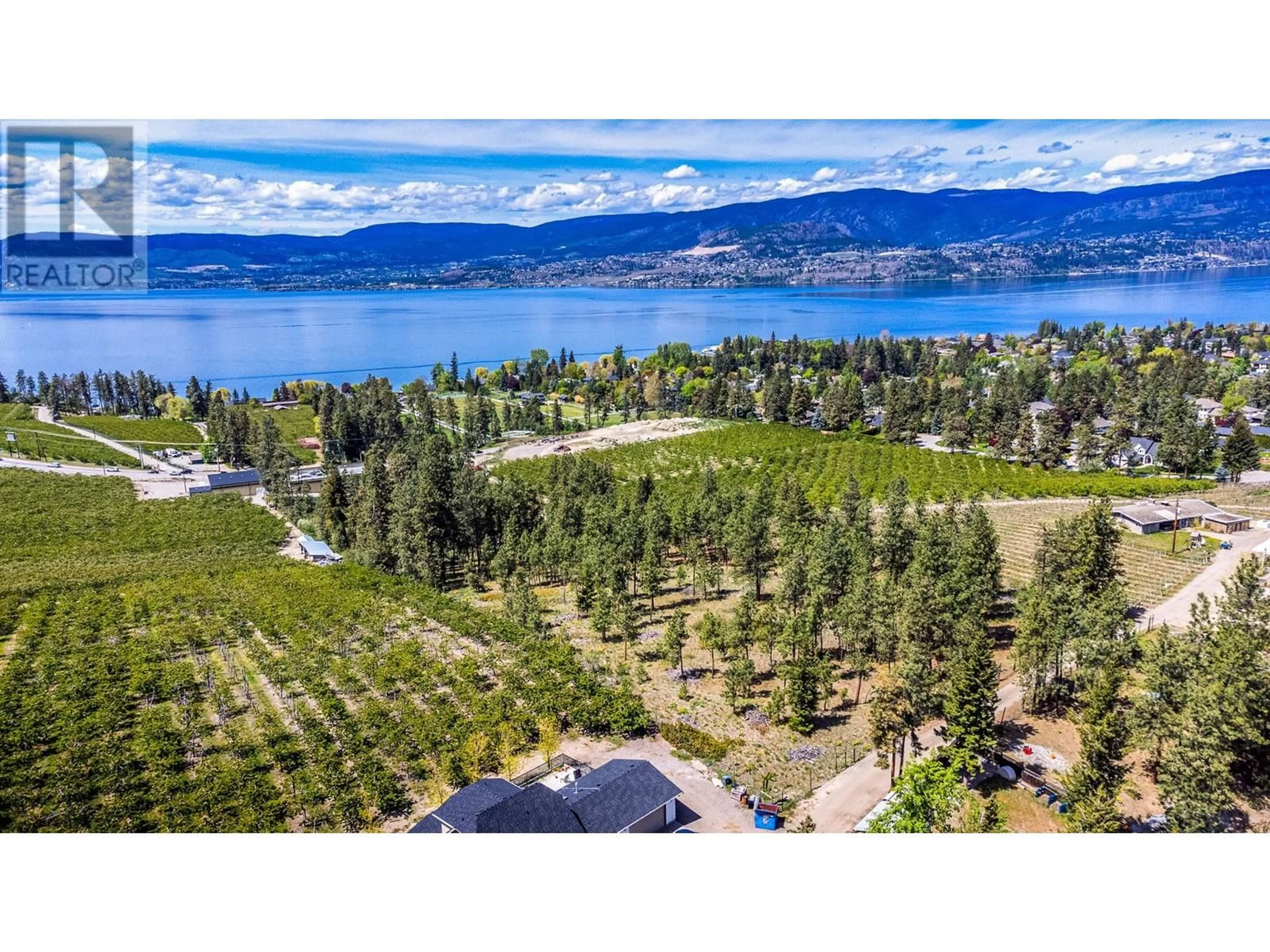 A pic from outside/outdoor area/front of a property/back of a property/a pic from drone, water/lake/river/ocean view for 4729 LAKESHORE ROAD, Kelowna British Columbia V1W4H6