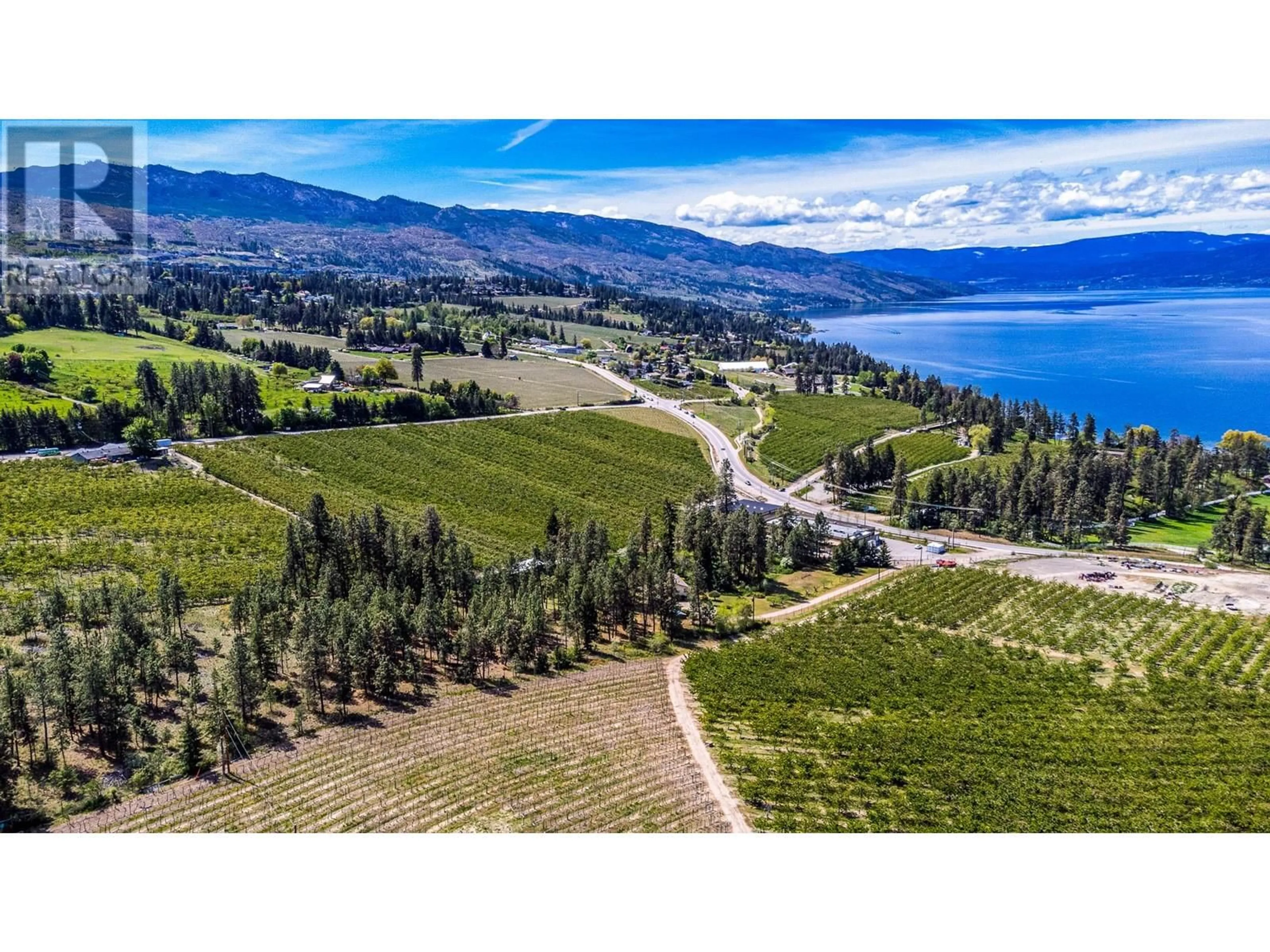 A pic from outside/outdoor area/front of a property/back of a property/a pic from drone, water/lake/river/ocean view for 4729 LAKESHORE ROAD, Kelowna British Columbia V1W4H6