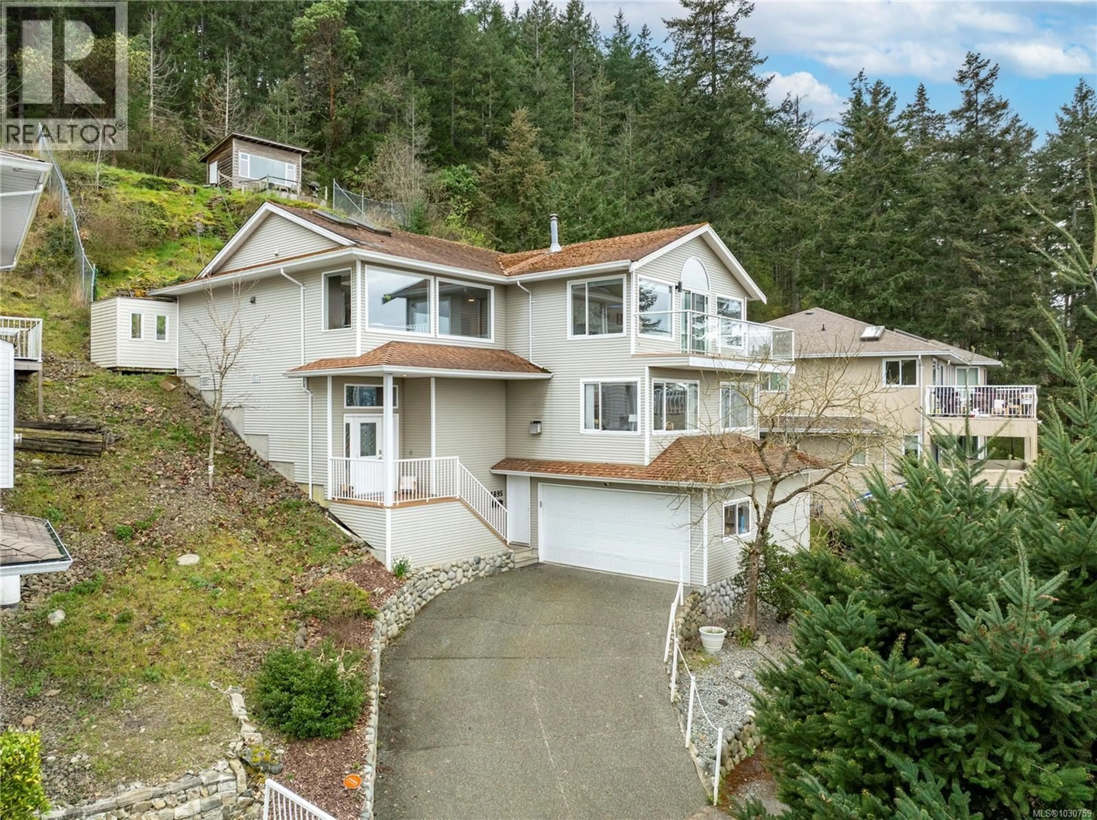 A pic from outside/outdoor area/front of a property/back of a property/a pic from drone, street for 4895 LAGUNA WAY, Nanaimo British Columbia V9T5C2