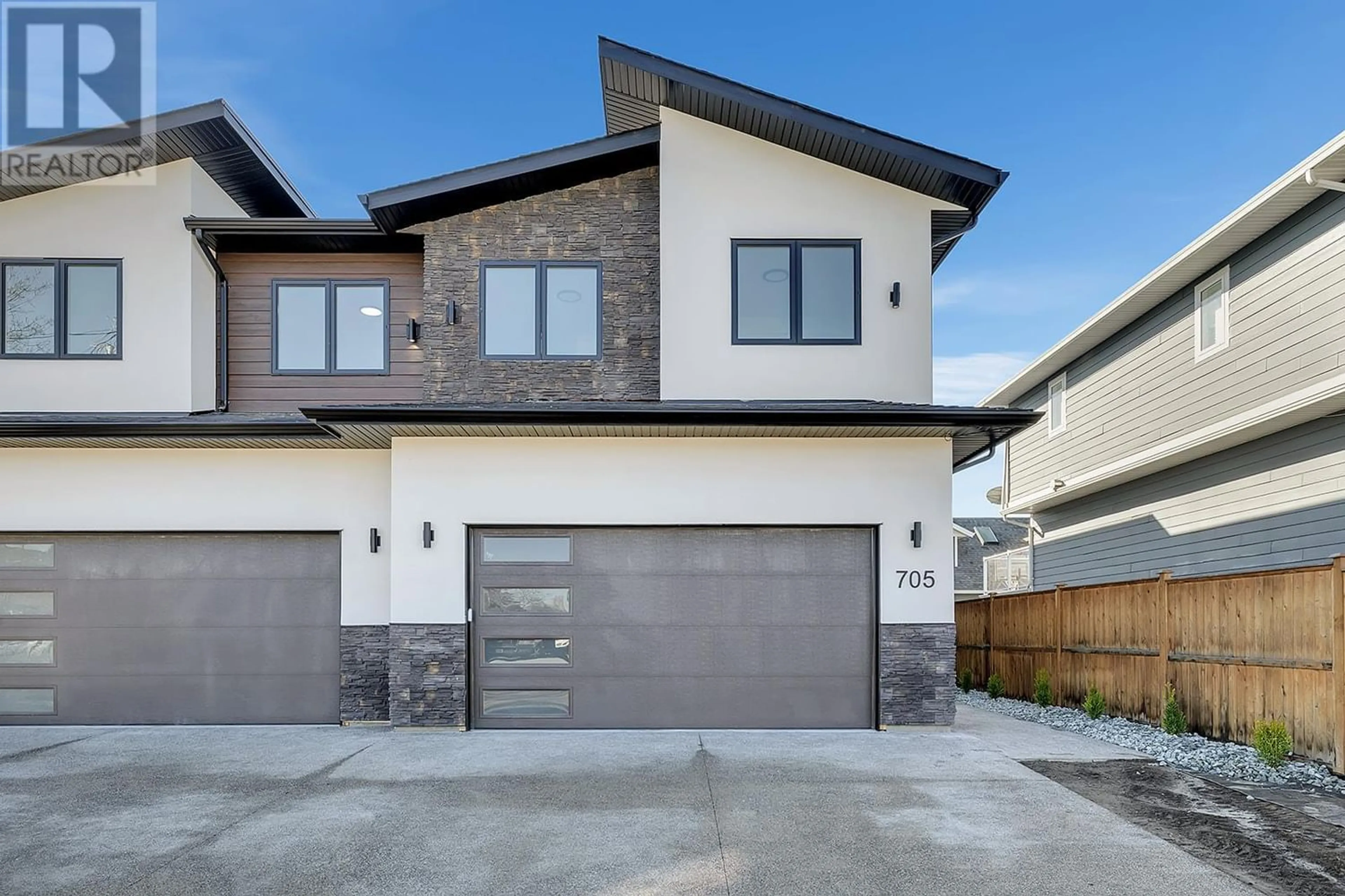 Frontside or backside of a home for 705 Raymer Road, Kelowna British Columbia V1W1H6
