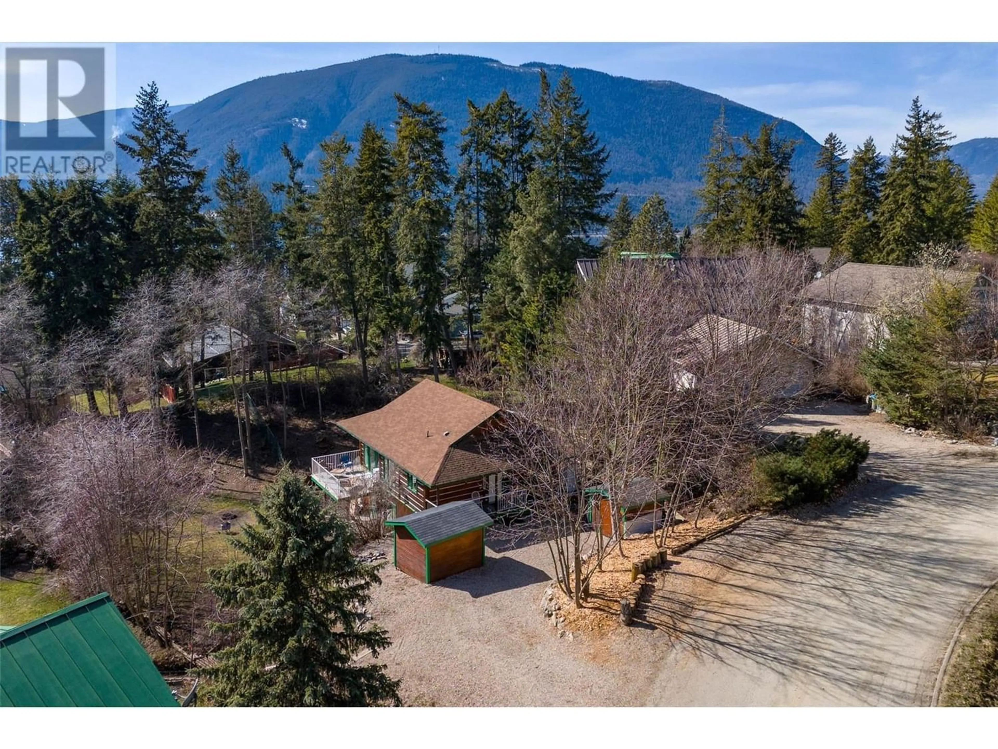 Frontside or backside of a home, the fenced backyard for 412 Sumac Road, Tappen British Columbia V0E2X1