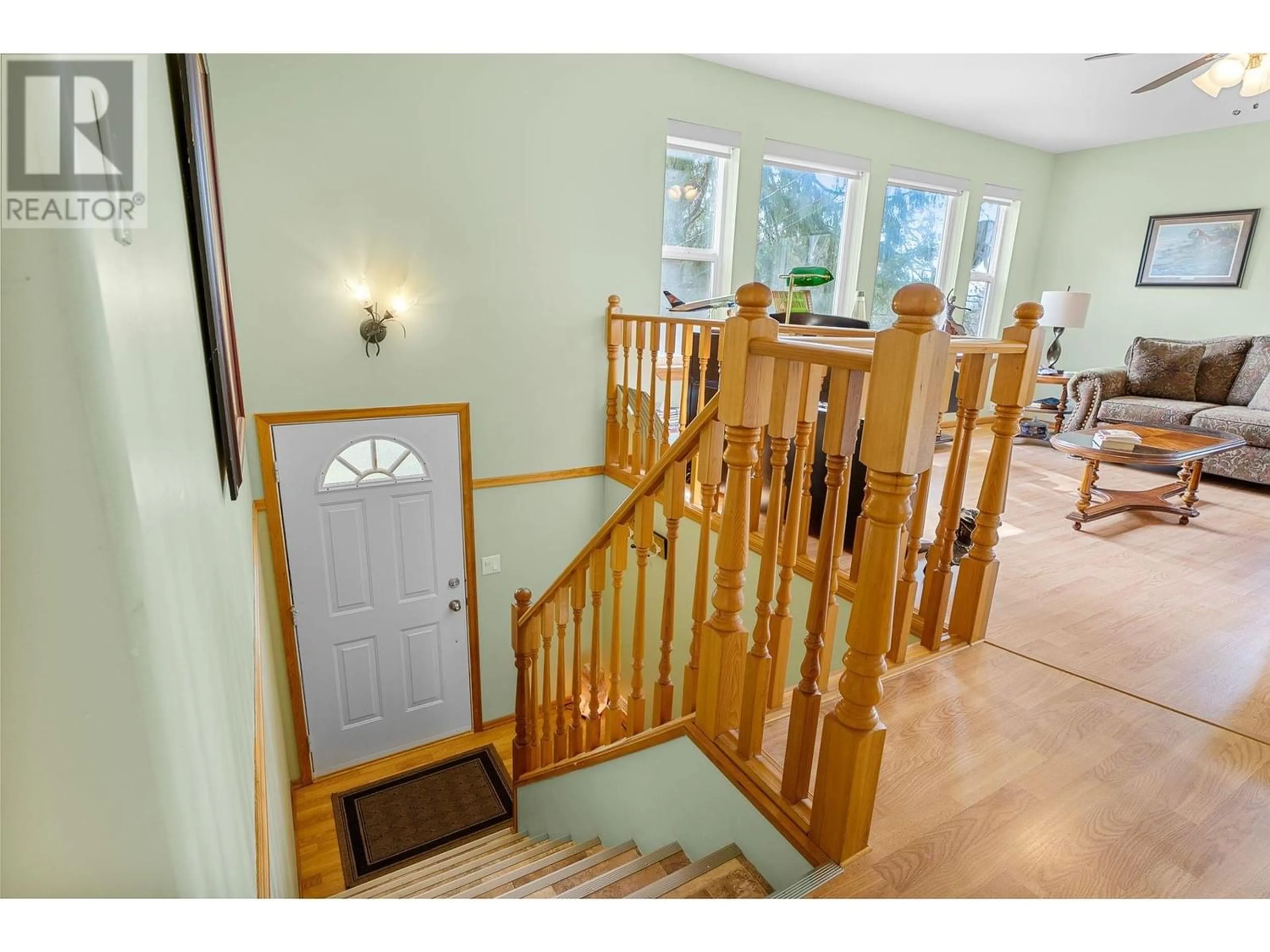 Indoor foyer, wood floors for 7451 Estate Drive, Anglemont British Columbia V0E1M8