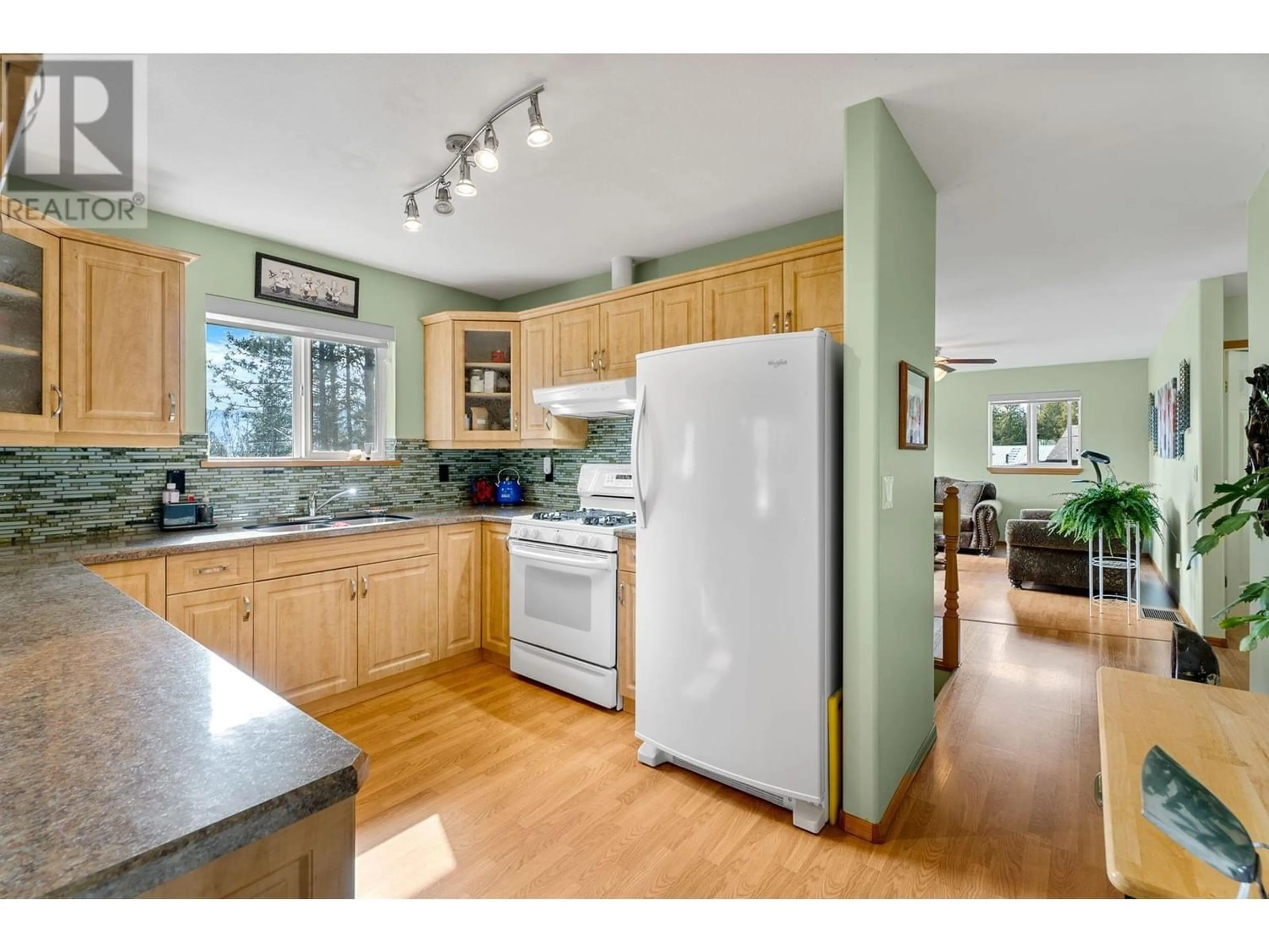 Kitchen, wood floors, cottage for 7451 Estate Drive, Anglemont British Columbia V0E1M8