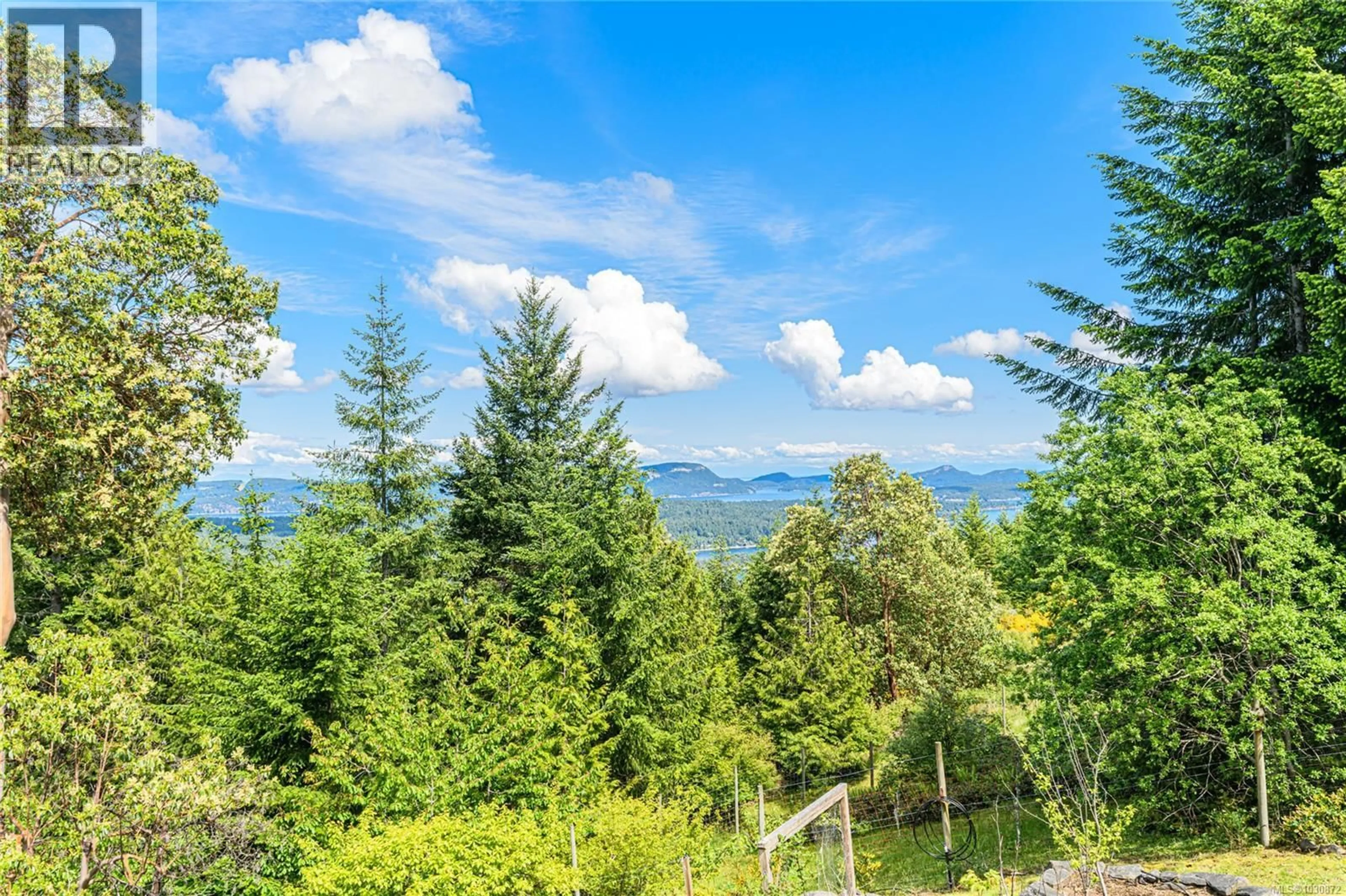 A pic from outside/outdoor area/front of a property/back of a property/a pic from drone, forest/trees view for 200 WILKIE WAY, Salt Spring British Columbia V8K2J4
