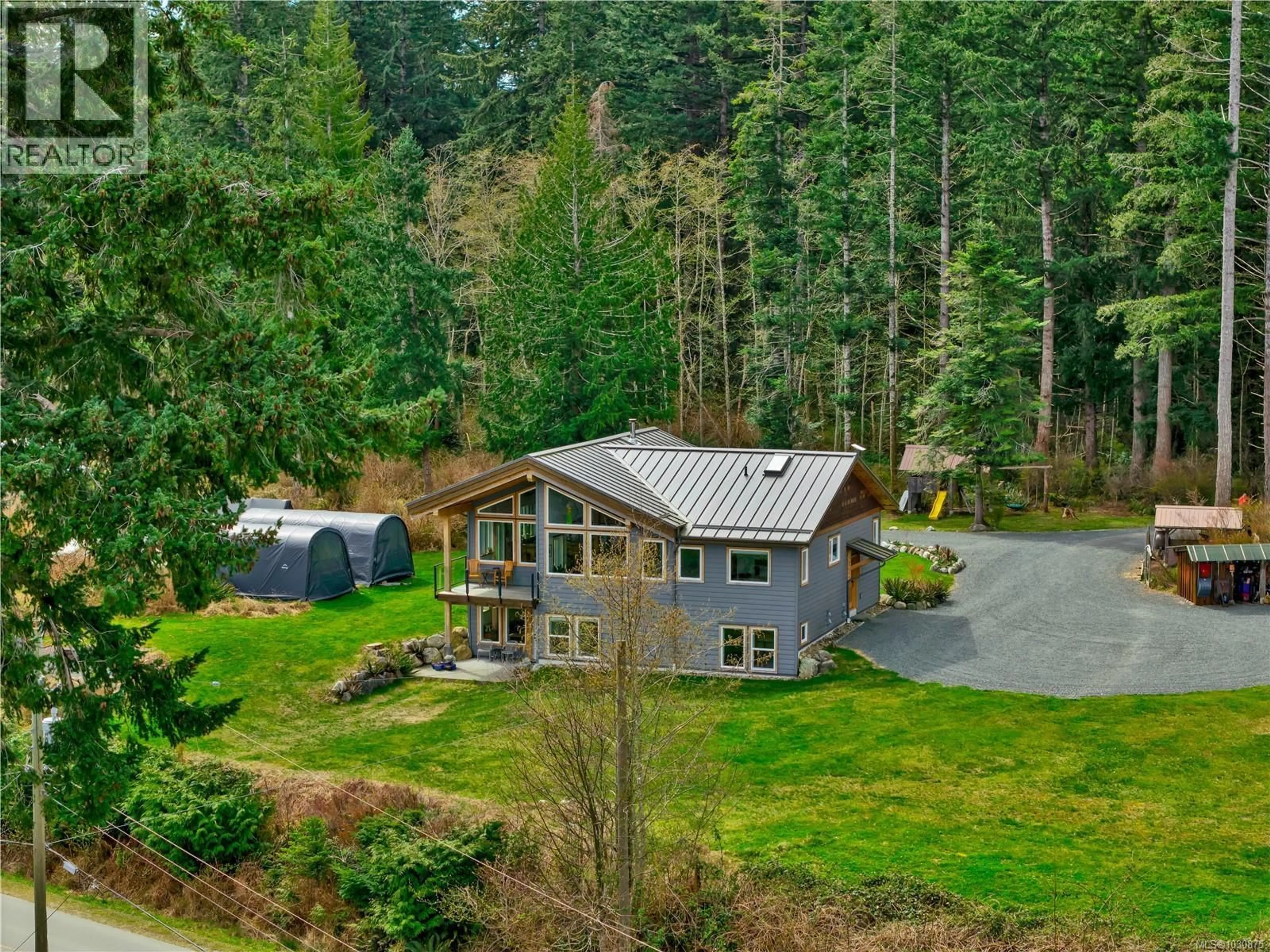 A pic from outside/outdoor area/front of a property/back of a property/a pic from drone, forest/trees view for 609 VALPY ROAD, Quadra Island British Columbia V0P1N0