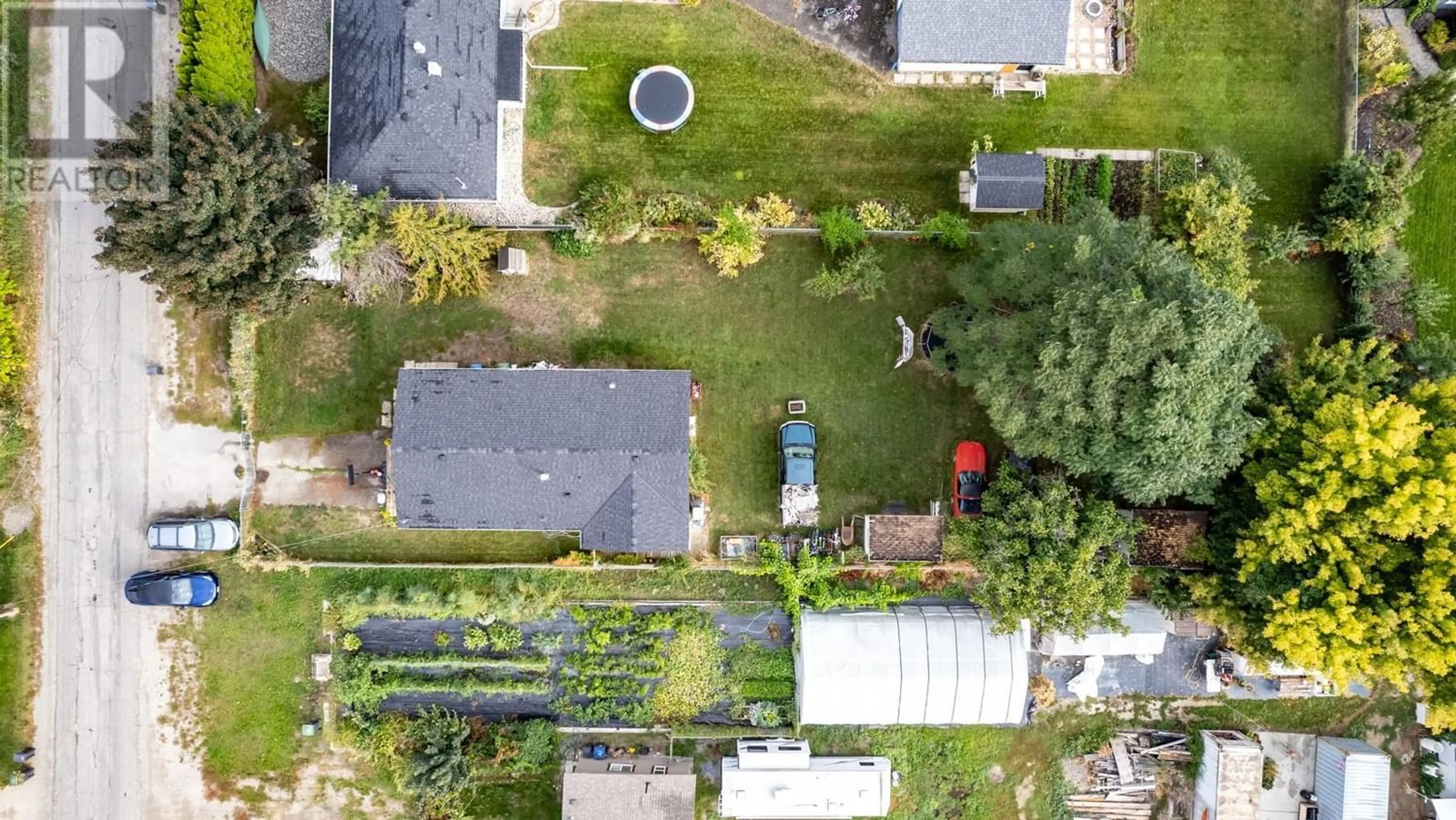 A pic from exterior of the house or condo, the fenced backyard for 11337 Reiswig Road, Lake Country British Columbia V4V1X5