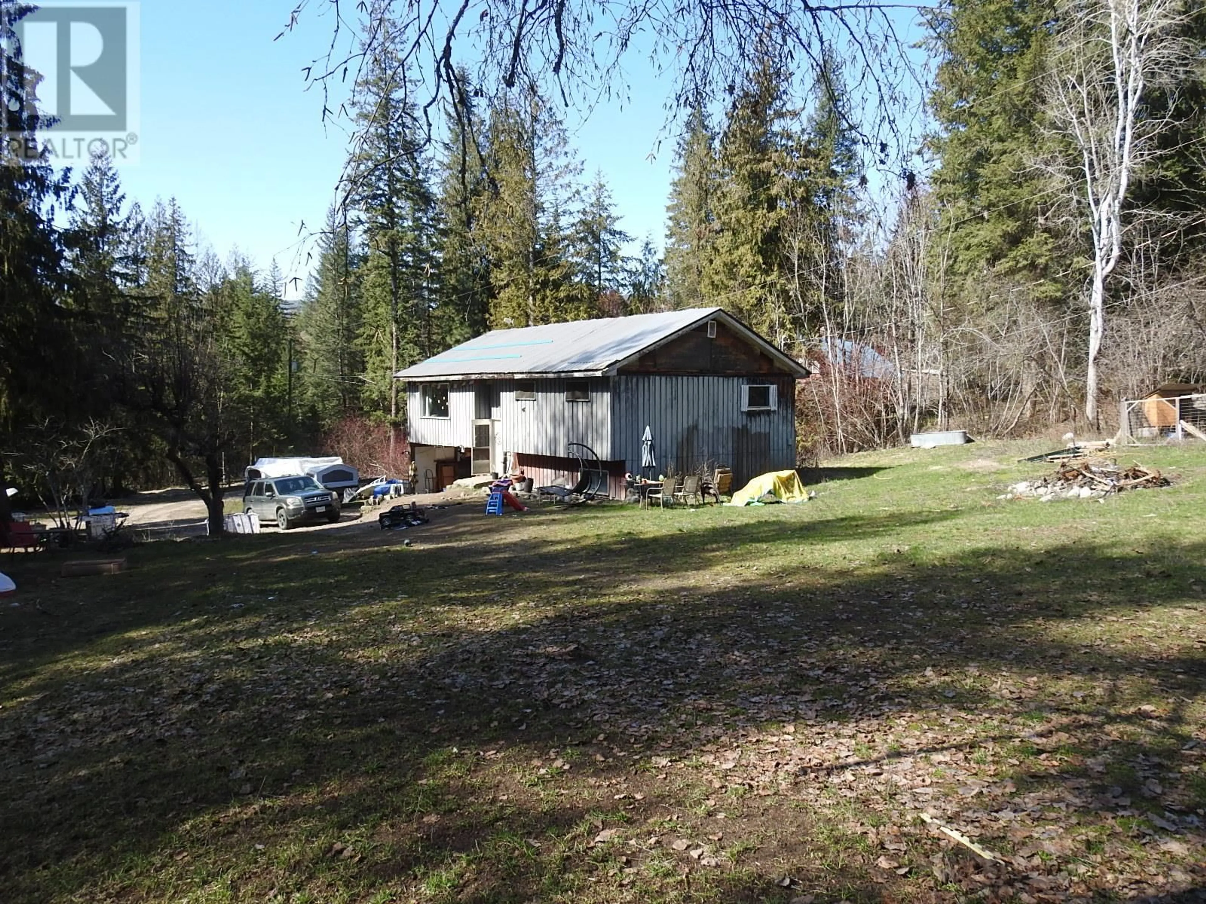 A pic from outside/outdoor area/front of a property/back of a property/a pic from drone, unknown for 50 EAST POIRIER ROAD, Mara British Columbia V0E2K0