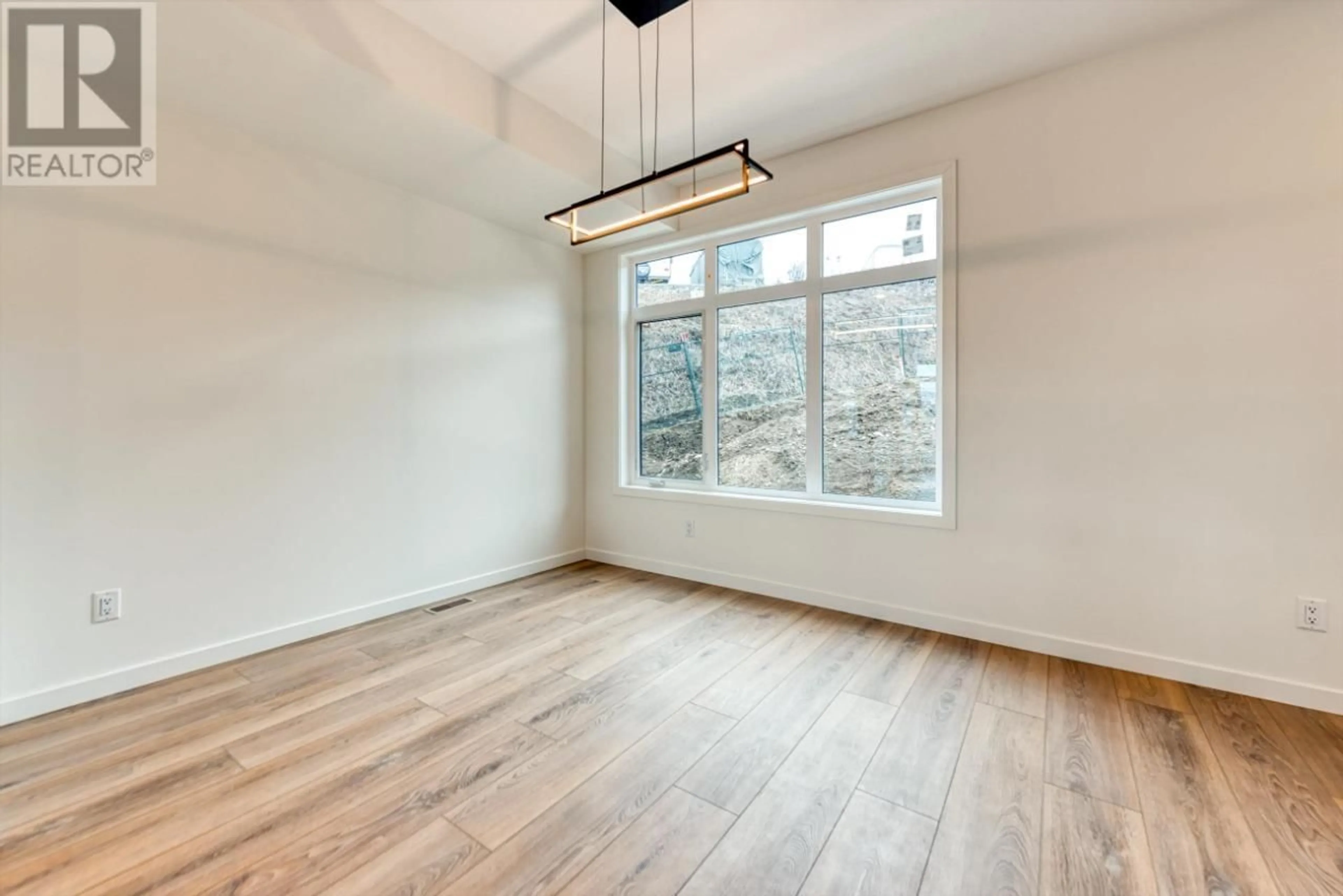 A pic of a room, wood floors for 7599 Klinger Road Unit# 2, Vernon British Columbia V1H1G9