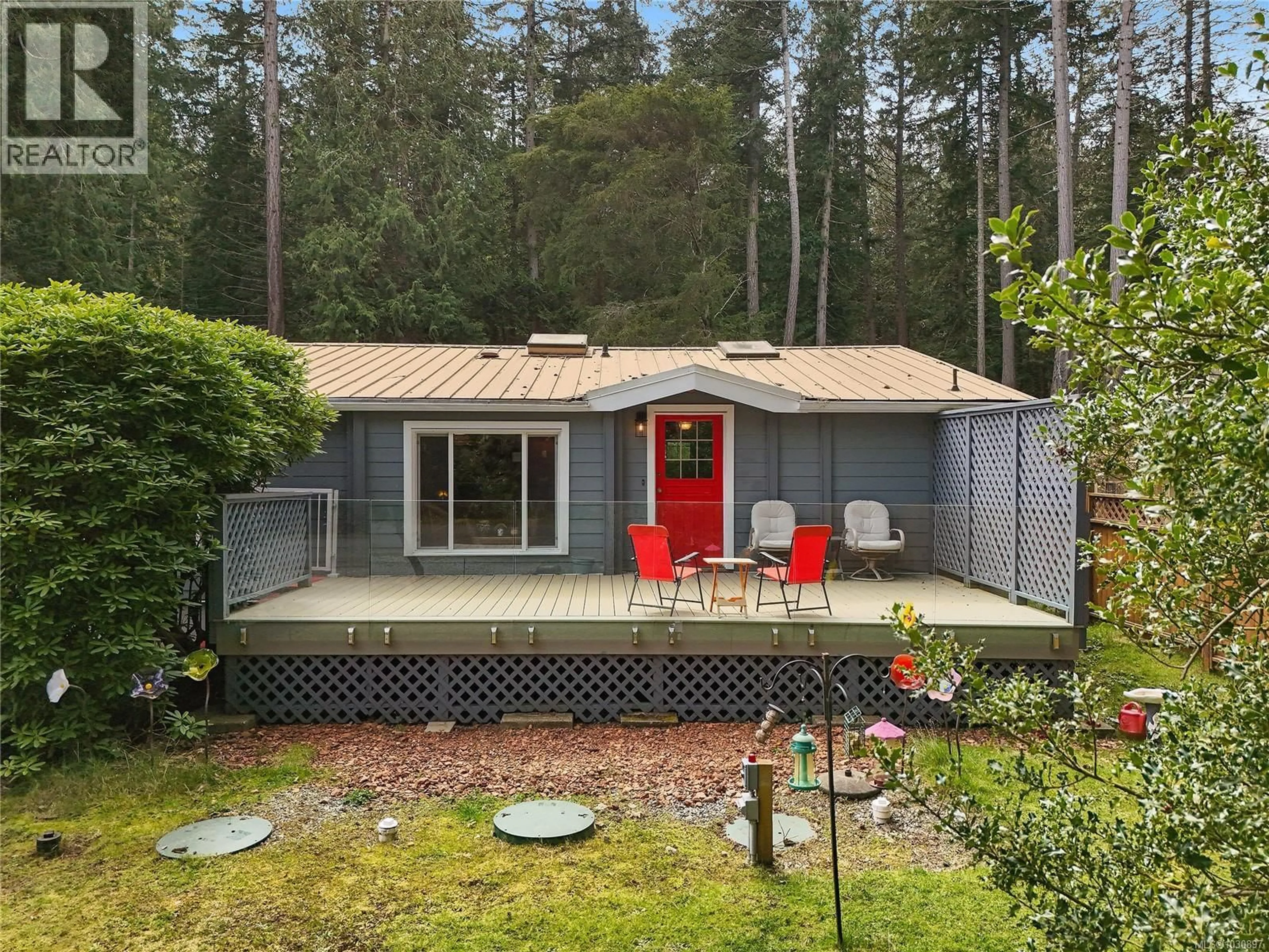 Home with vinyl exterior material, forest/trees view for 514 AYA REACH ROAD, Mayne Island British Columbia V0N2J2
