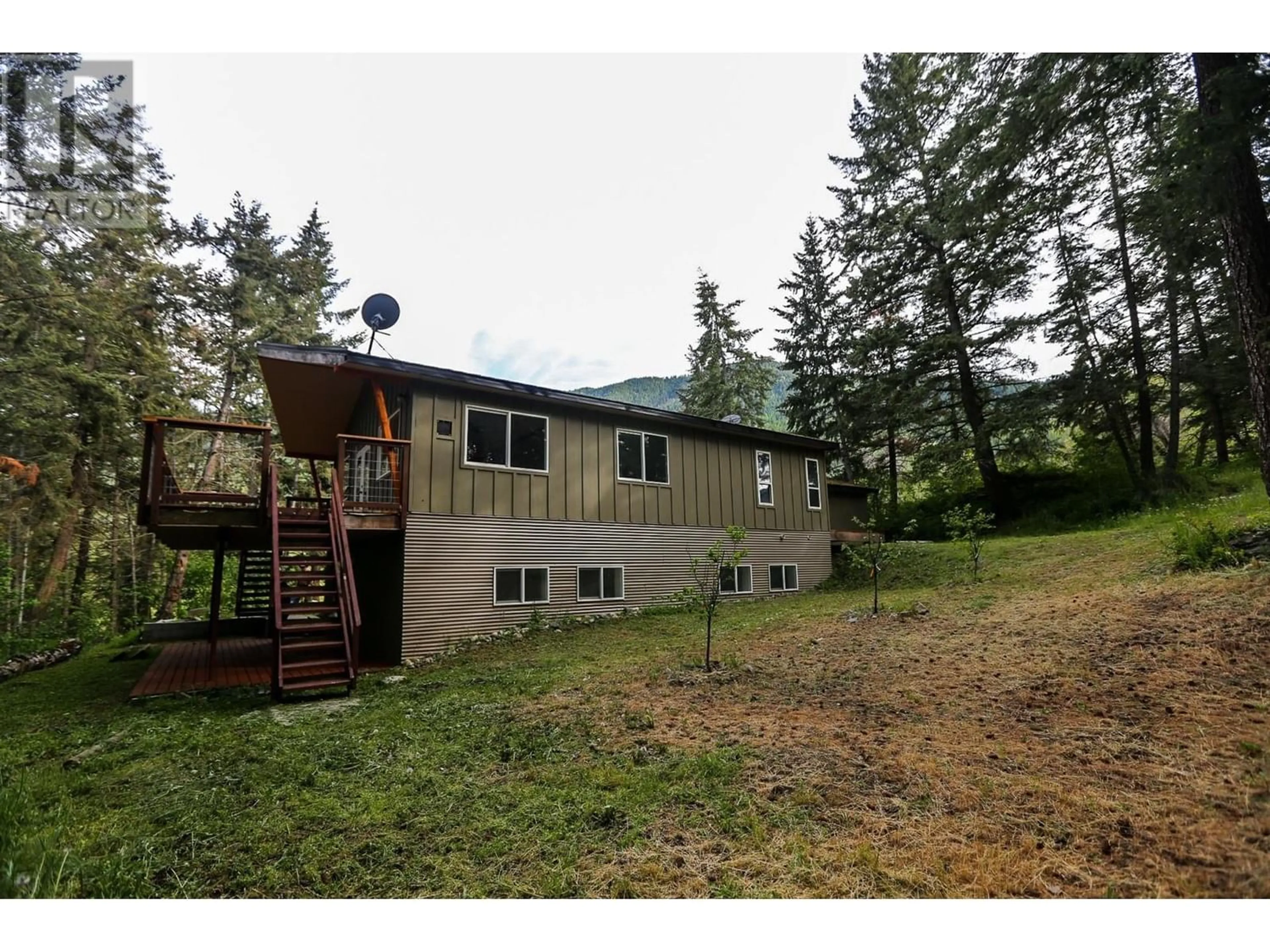 A pic from outside/outdoor area/front of a property/back of a property/a pic from drone, forest/trees view for 4598 Cedar Hill Road, Falkland British Columbia V0E1W1