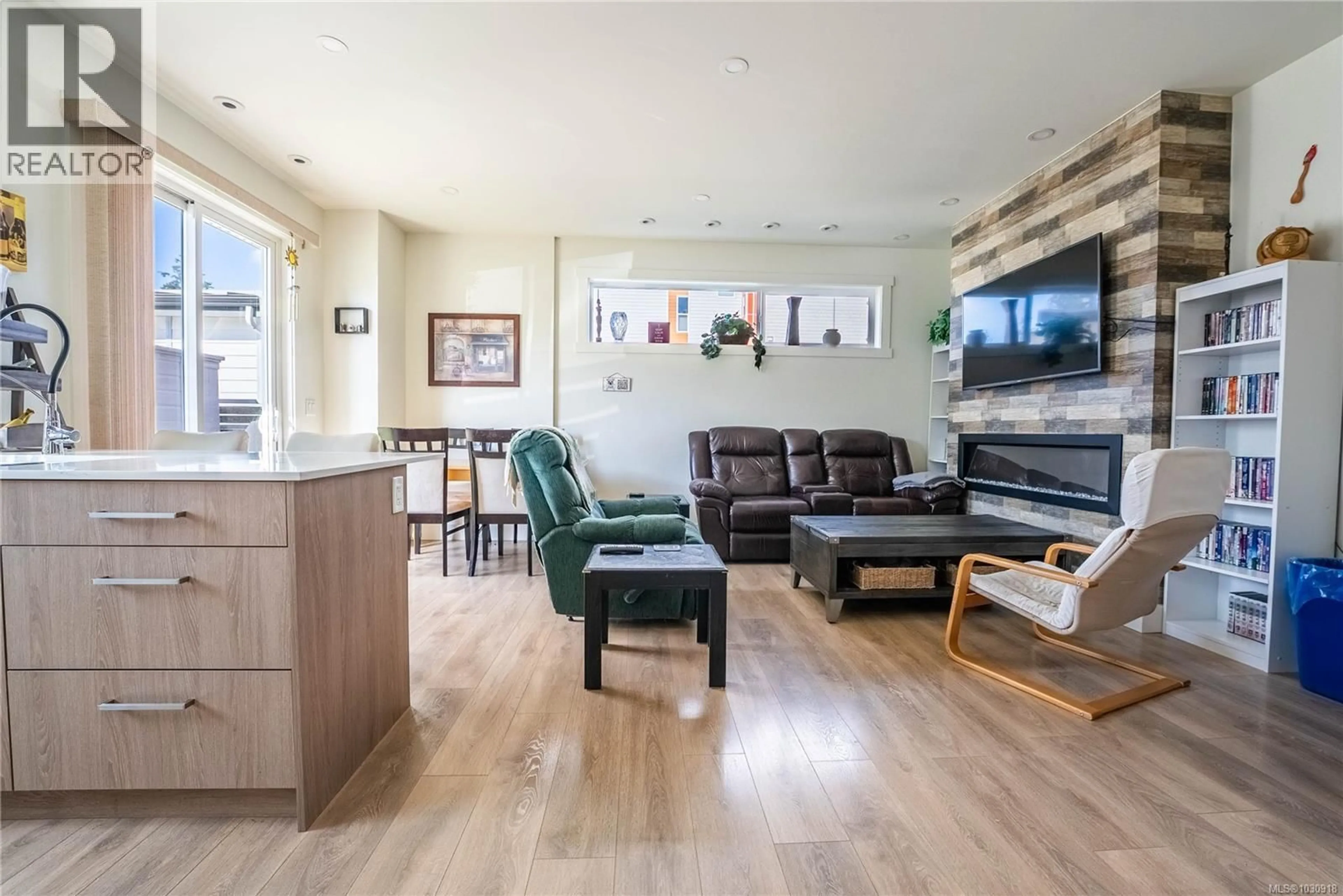 Living room with furniture, wood/laminate floor for 101 - 3321 RADIANT WAY, Langford British Columbia V9C2W4