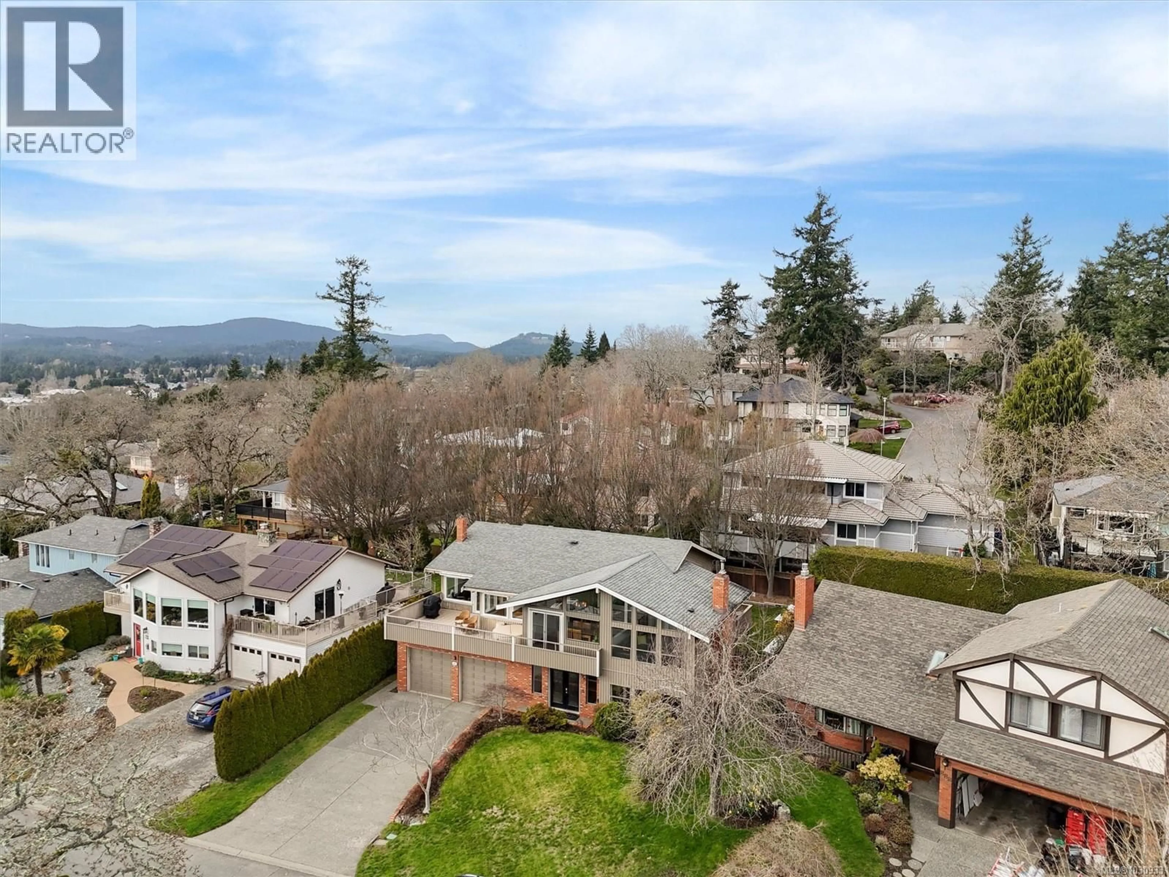 A pic from outside/outdoor area/front of a property/back of a property/a pic from drone, mountain view for 890 DENFORD CRESCENT, Saanich British Columbia V8X4N1