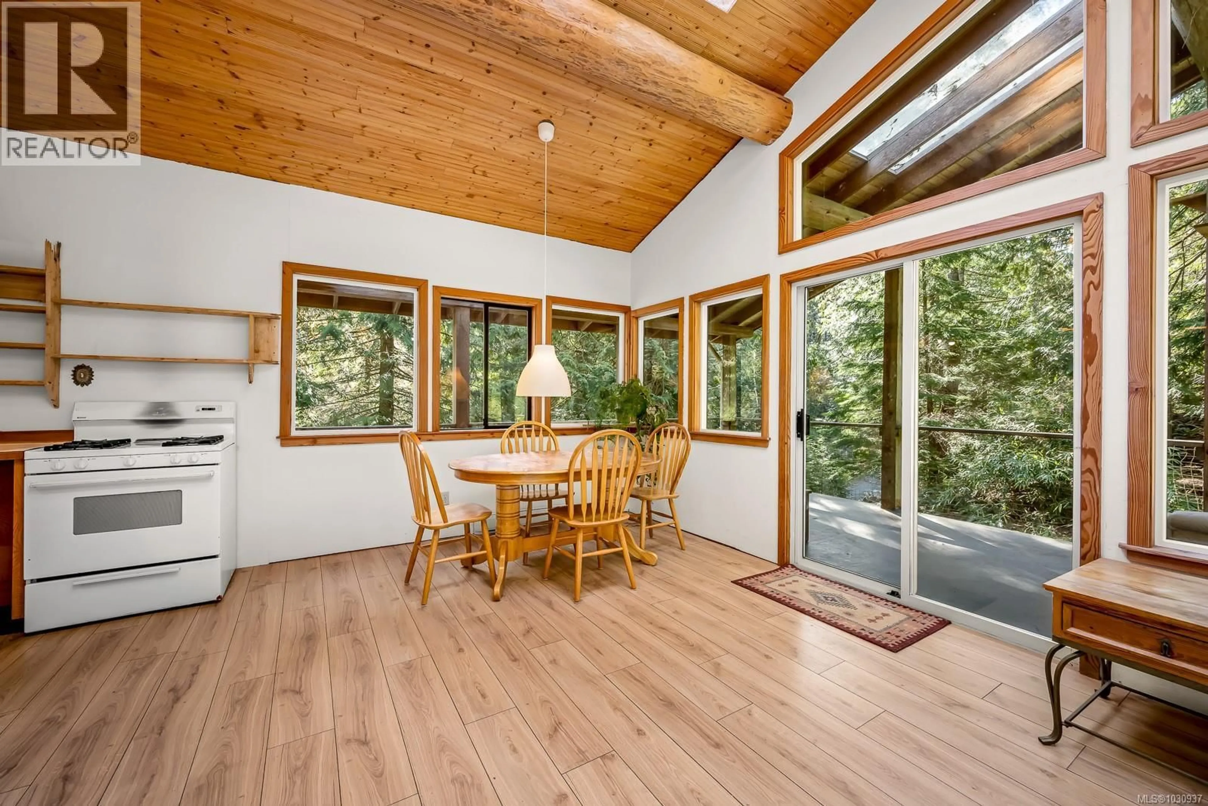 Dining room, wood/laminate floor for 421 WHALETOWN ROAD, Cortes Island British Columbia V0P1Z0