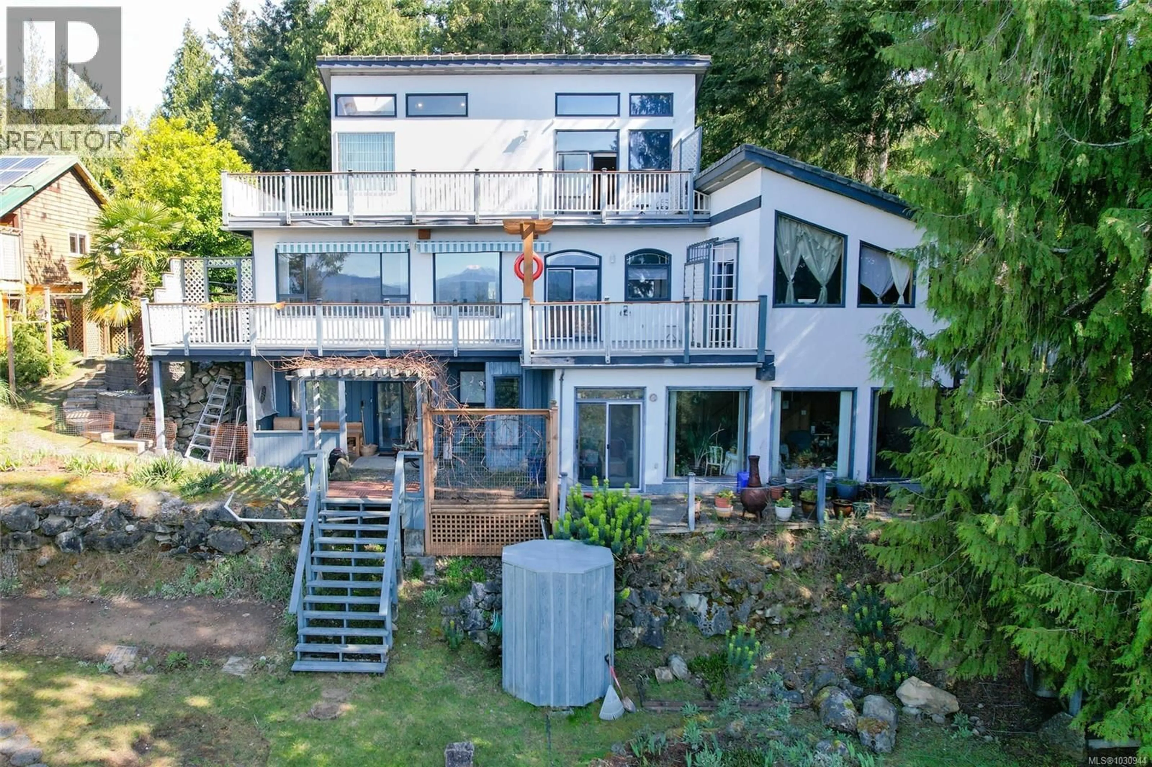 A pic from outside/outdoor area/front of a property/back of a property/a pic from drone, water/lake/river/ocean view for 1059 PAT BURNS AVENUE, Gabriola Island British Columbia V0R1X2