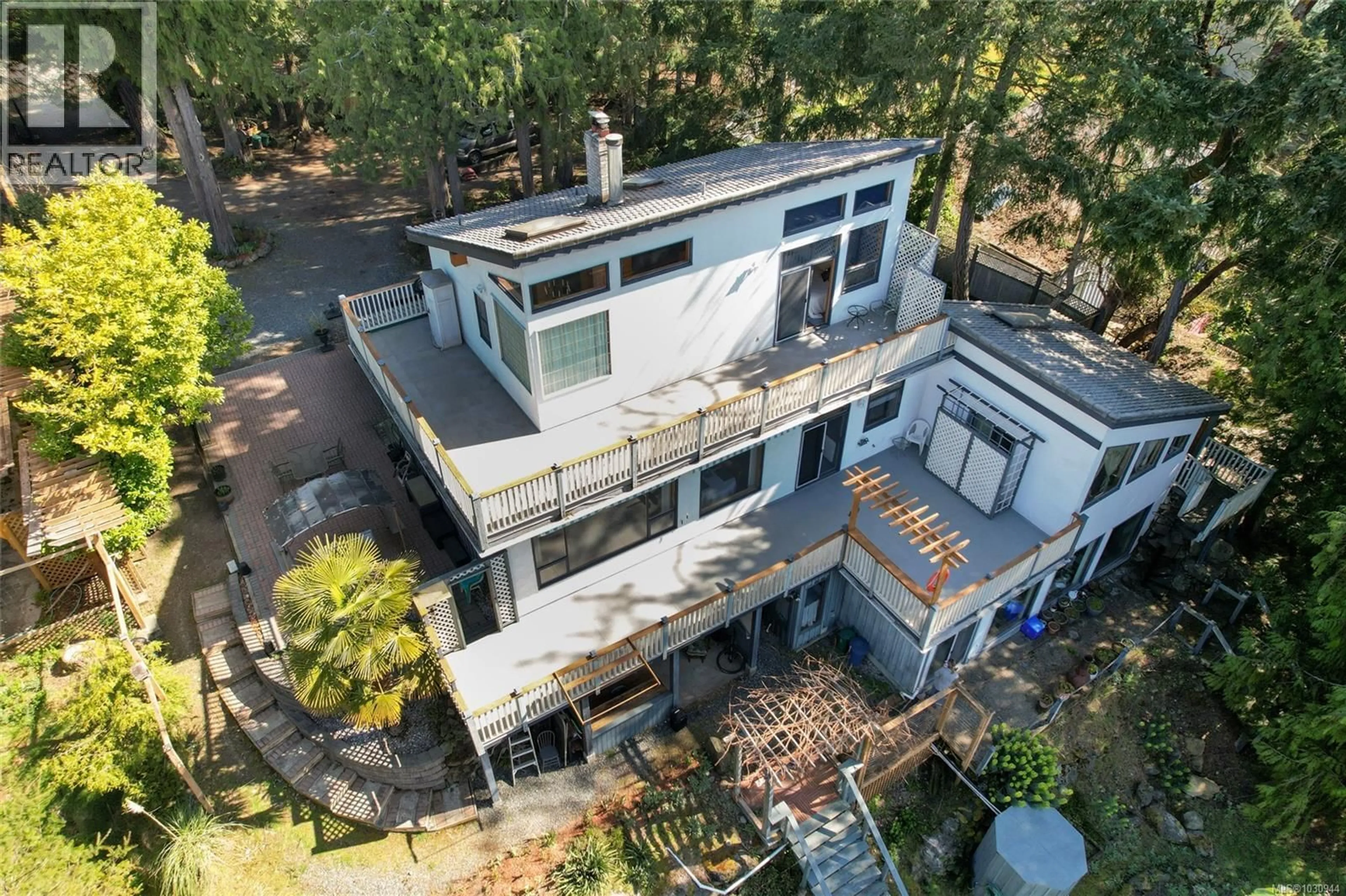 A pic from outside/outdoor area/front of a property/back of a property/a pic from drone, building for 1059 PAT BURNS AVENUE, Gabriola Island British Columbia V0R1X2
