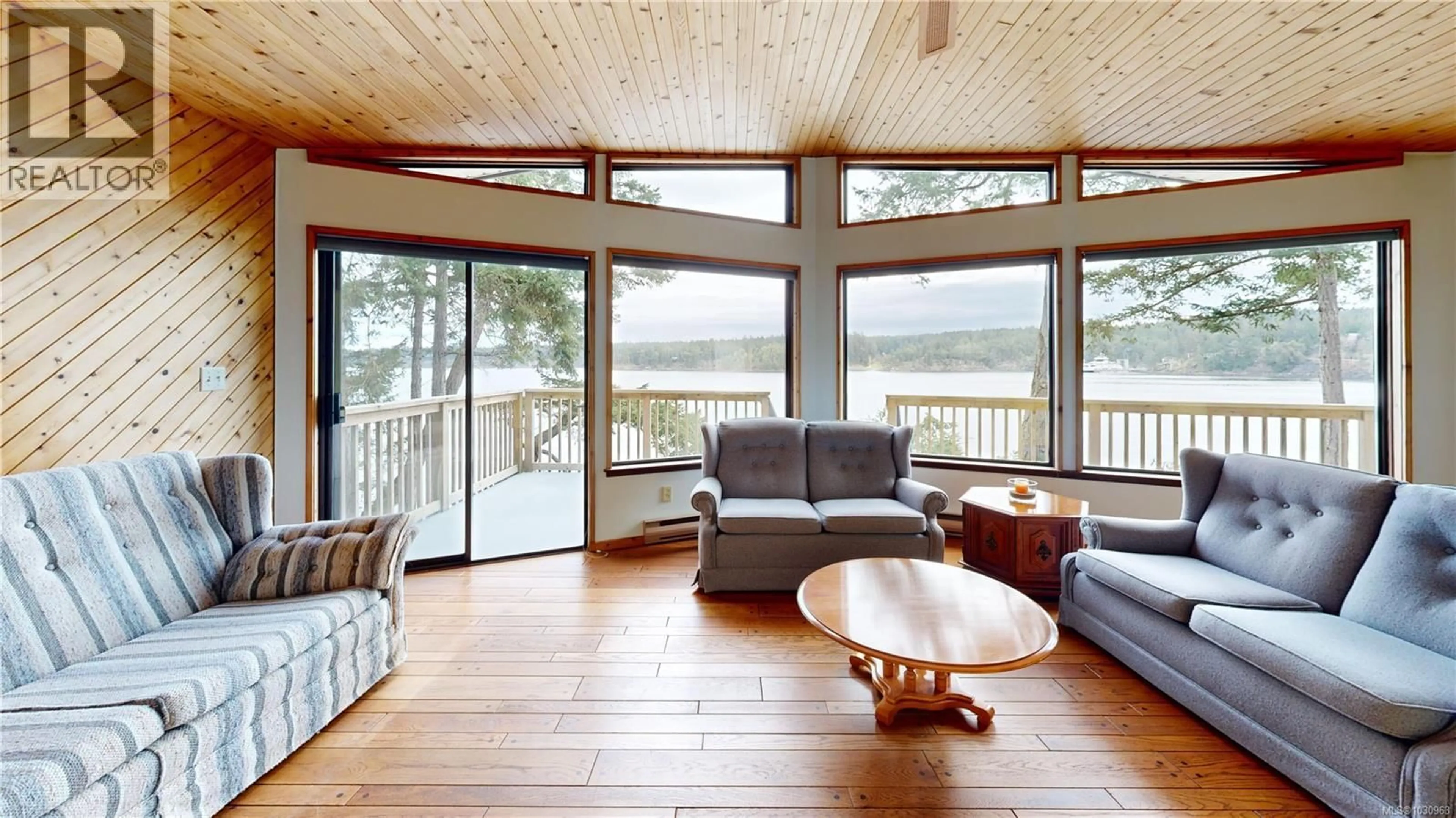 Living room with furniture, wood/laminate floor for 130 EASTHOM ROAD, Gabriola Island British Columbia V0R1X2