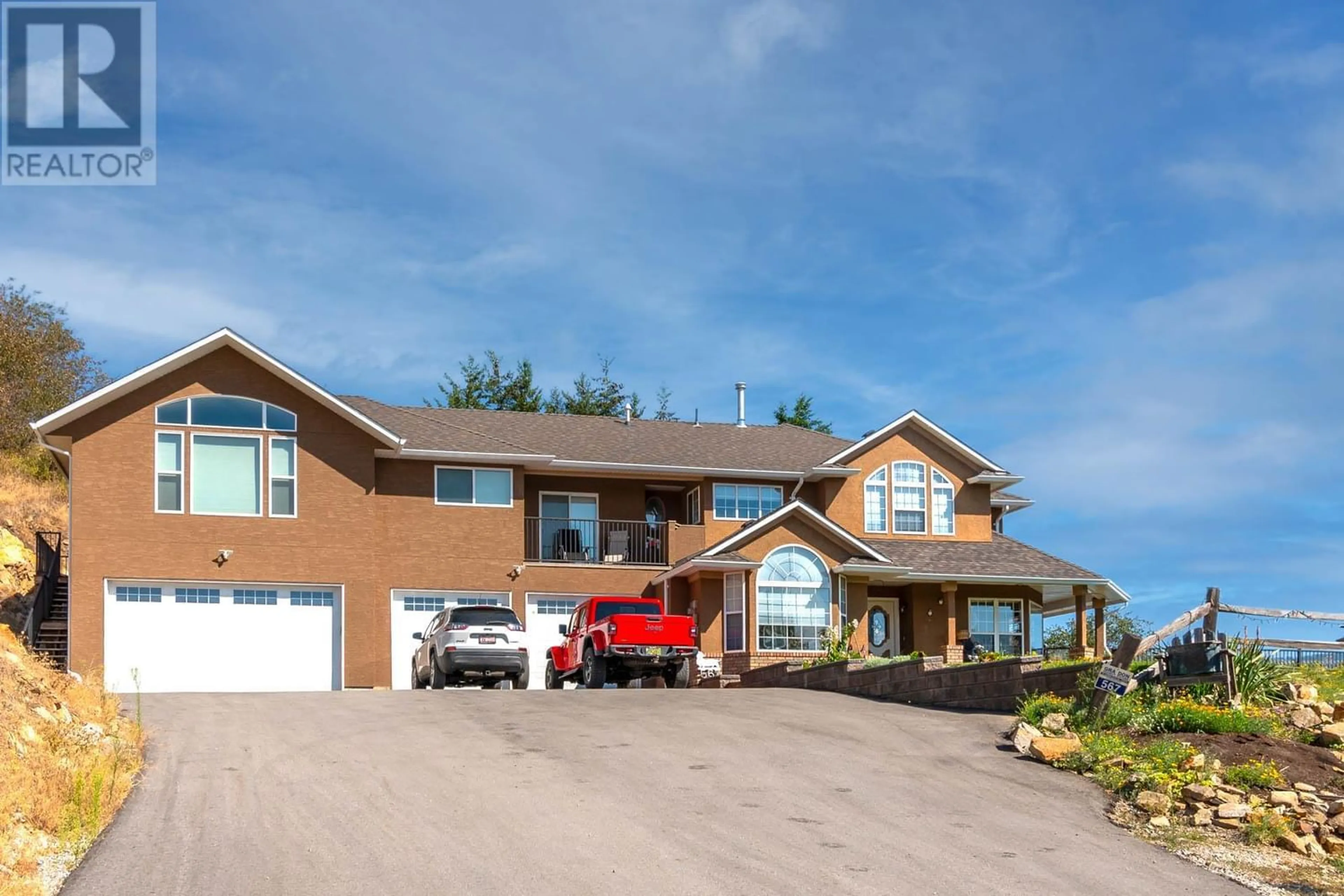 Frontside or backside of a home for 567 Cypress Drive, Coldstream British Columbia V1B2X9