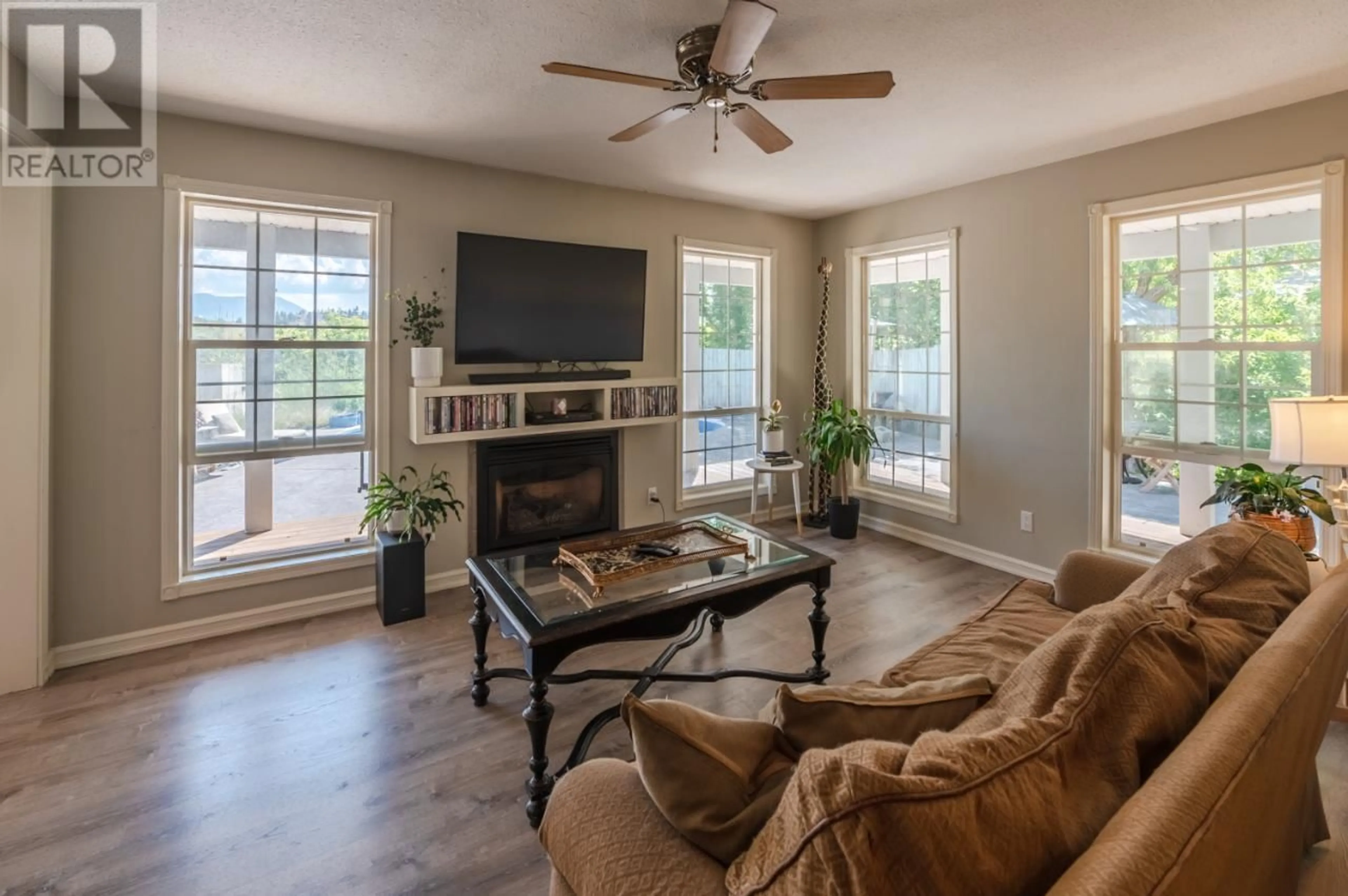 Living room with furniture, wood/laminate floor for 18740 OLD RICHTER PASS Road, Osoyoos British Columbia V0H1V5