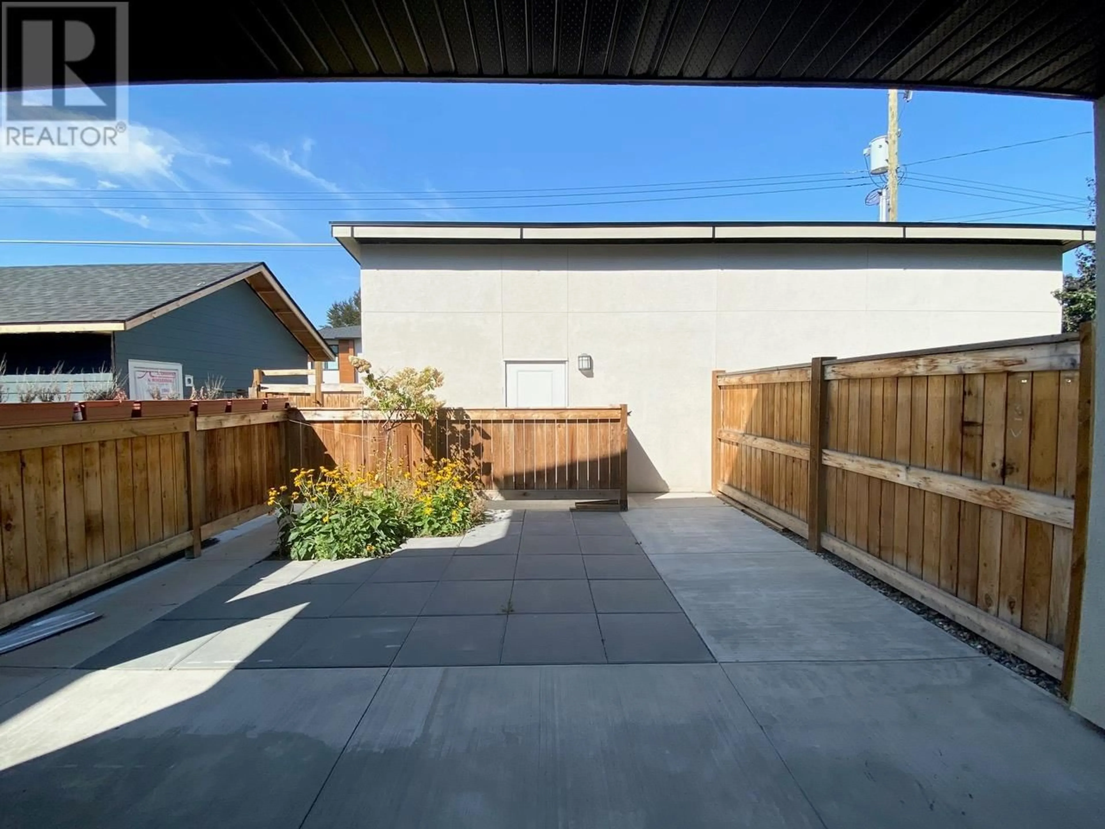 Patio, the fenced backyard for 1056 Martin Avenue Unit# 3, Kelowna British Columbia V1Y6V5